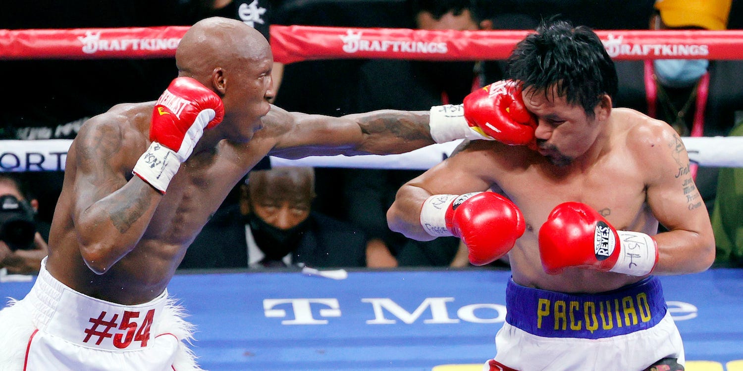 Yordenis Ugas punches Manny Pacquiao en route to his comfortable decision win in Las Vegas.