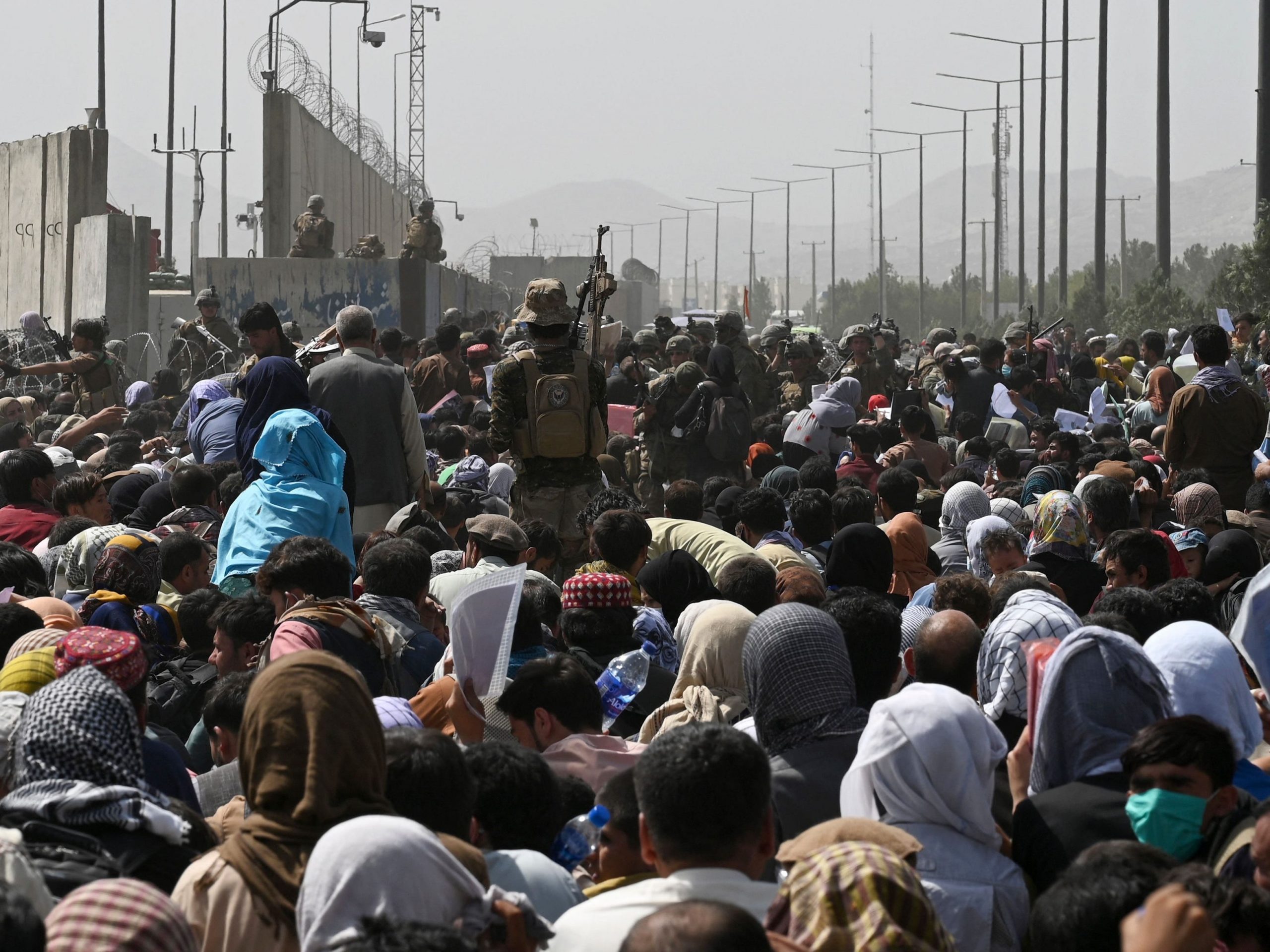 Thousands gather outside Kabul airport in hopes of getting on evacuation flight.