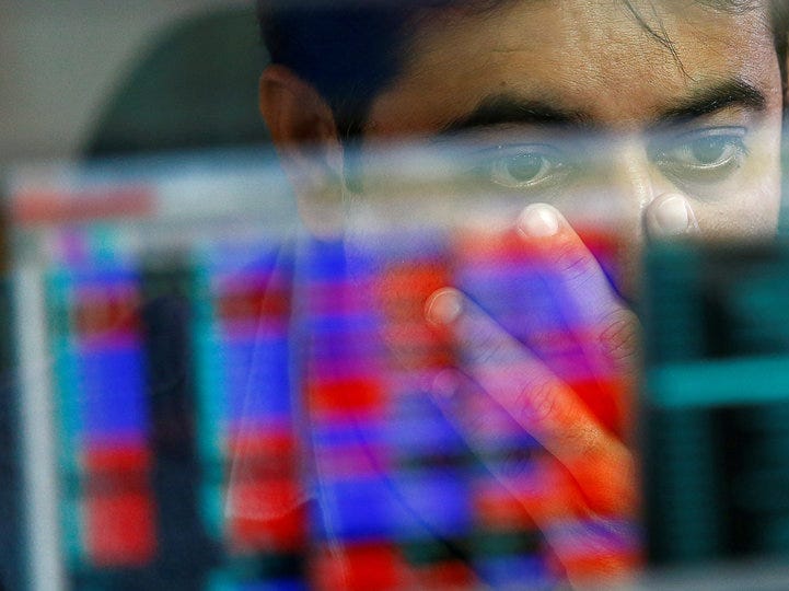 FILE PHOTO: A broker reacts while trading at his computer terminal at a stock brokerage firm in Mumbai, India, November 9, 2016. REUTERS/Danish Siddiqui/File Photo