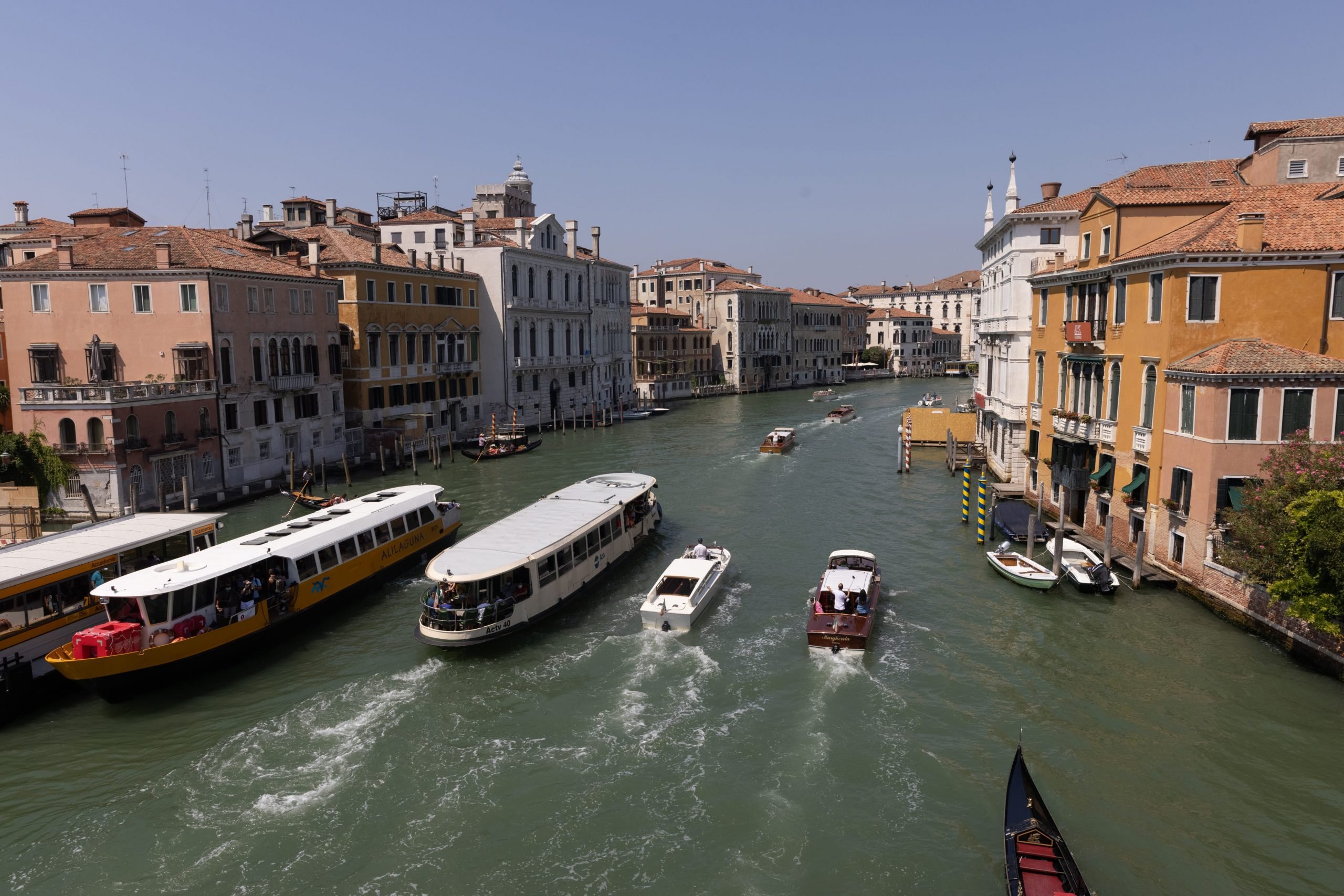 Tourist boats navigate Venetian canals in August 2021 now that travellers have returned to the floating city.