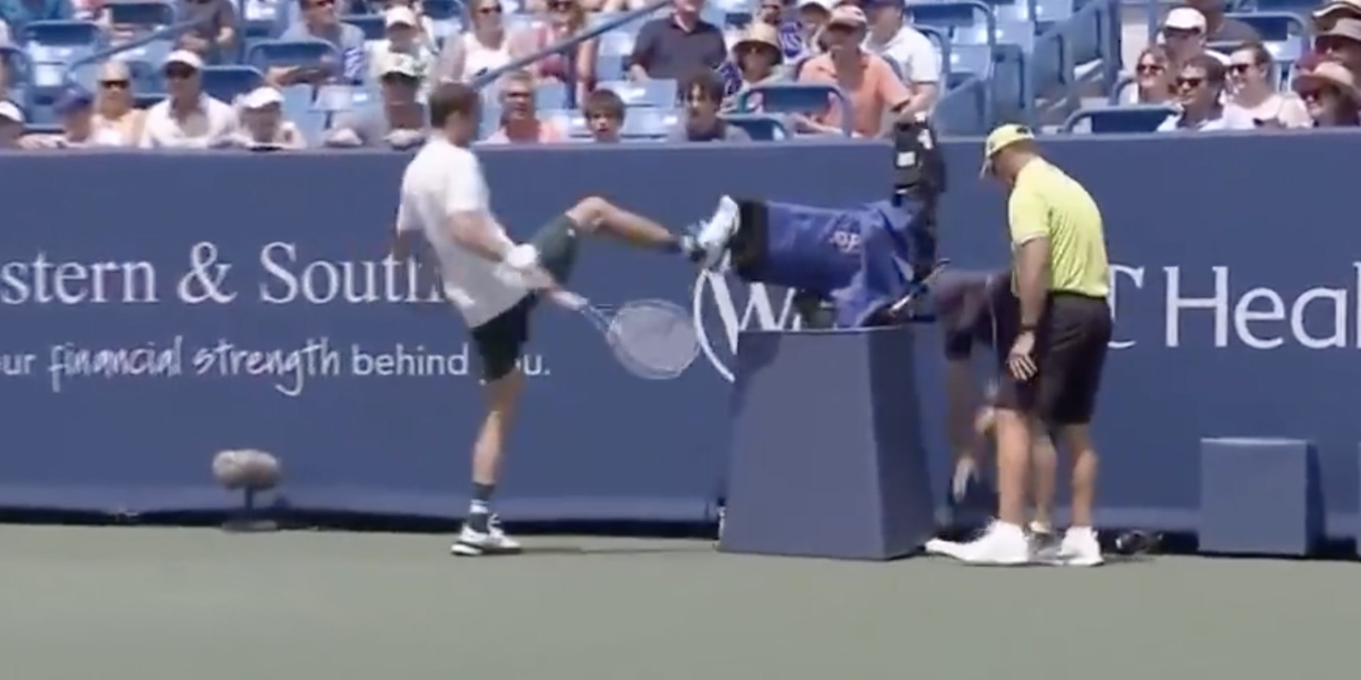 Daniil Medvedev kicks a camera during the 2021 Western and Southern Open.