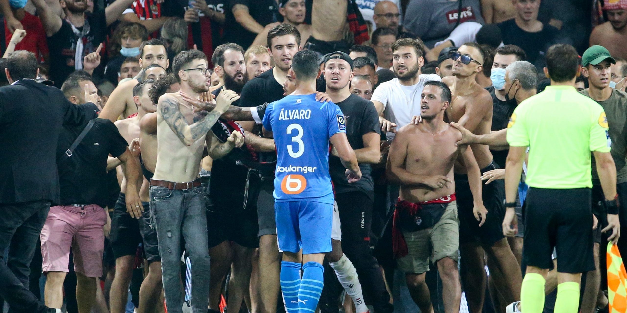 OGC Nice fans invade the pitch during their abandoned game against Marseille on Sunday August 22.