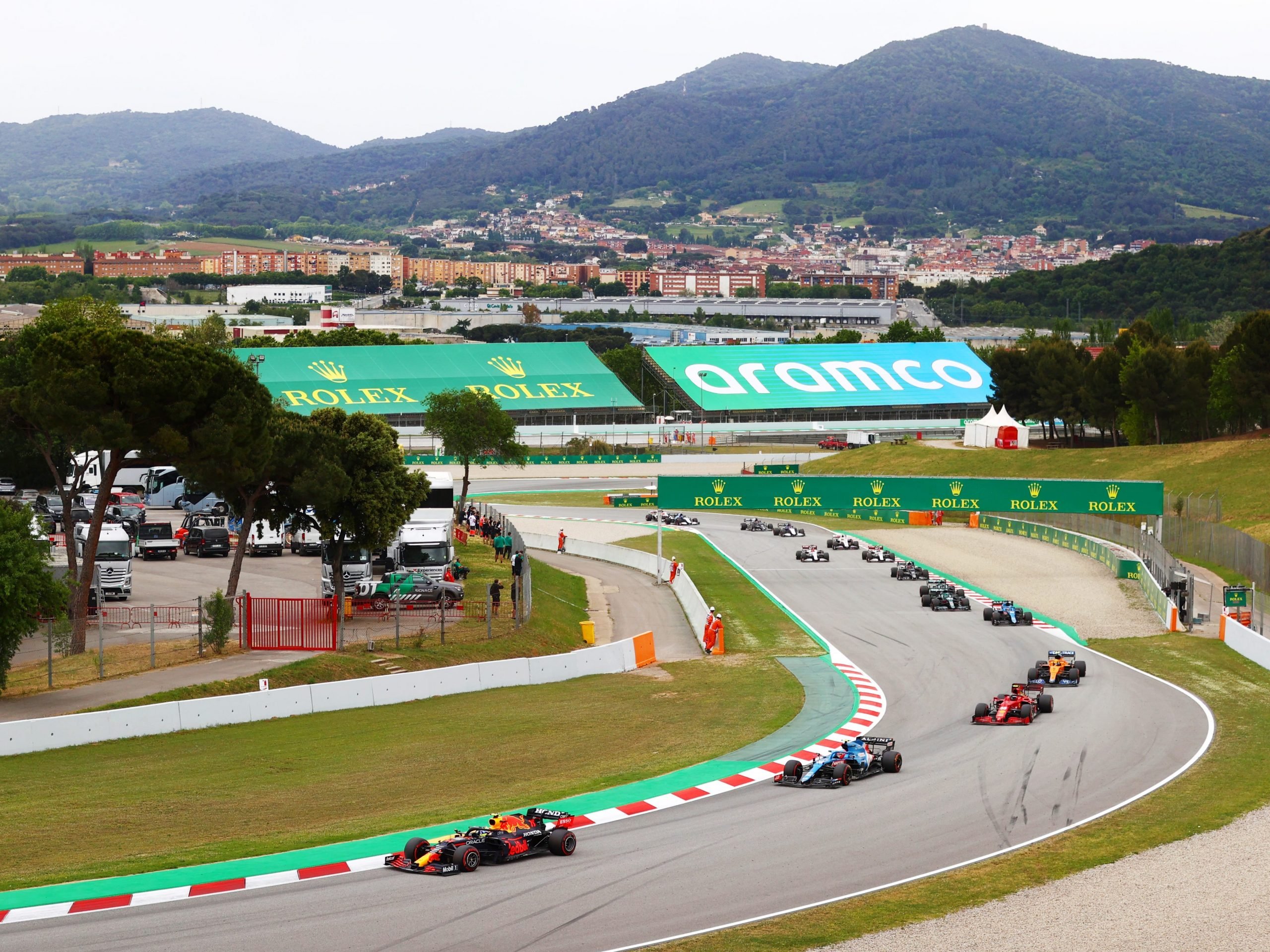 F1 cars go round a bend at the Spanish Grand Prix