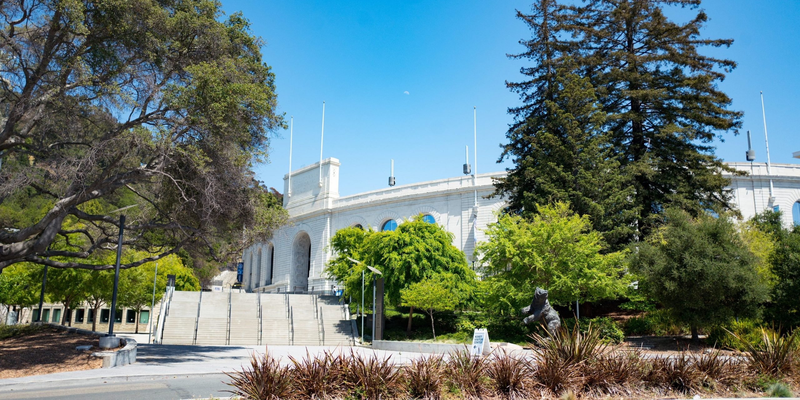 Iconic California Memorial Stadium among trees in the Berkeley Hills on a sunny day on the main campus of UC Berkeley in downtown Berkeley, California, May 21, 2018.