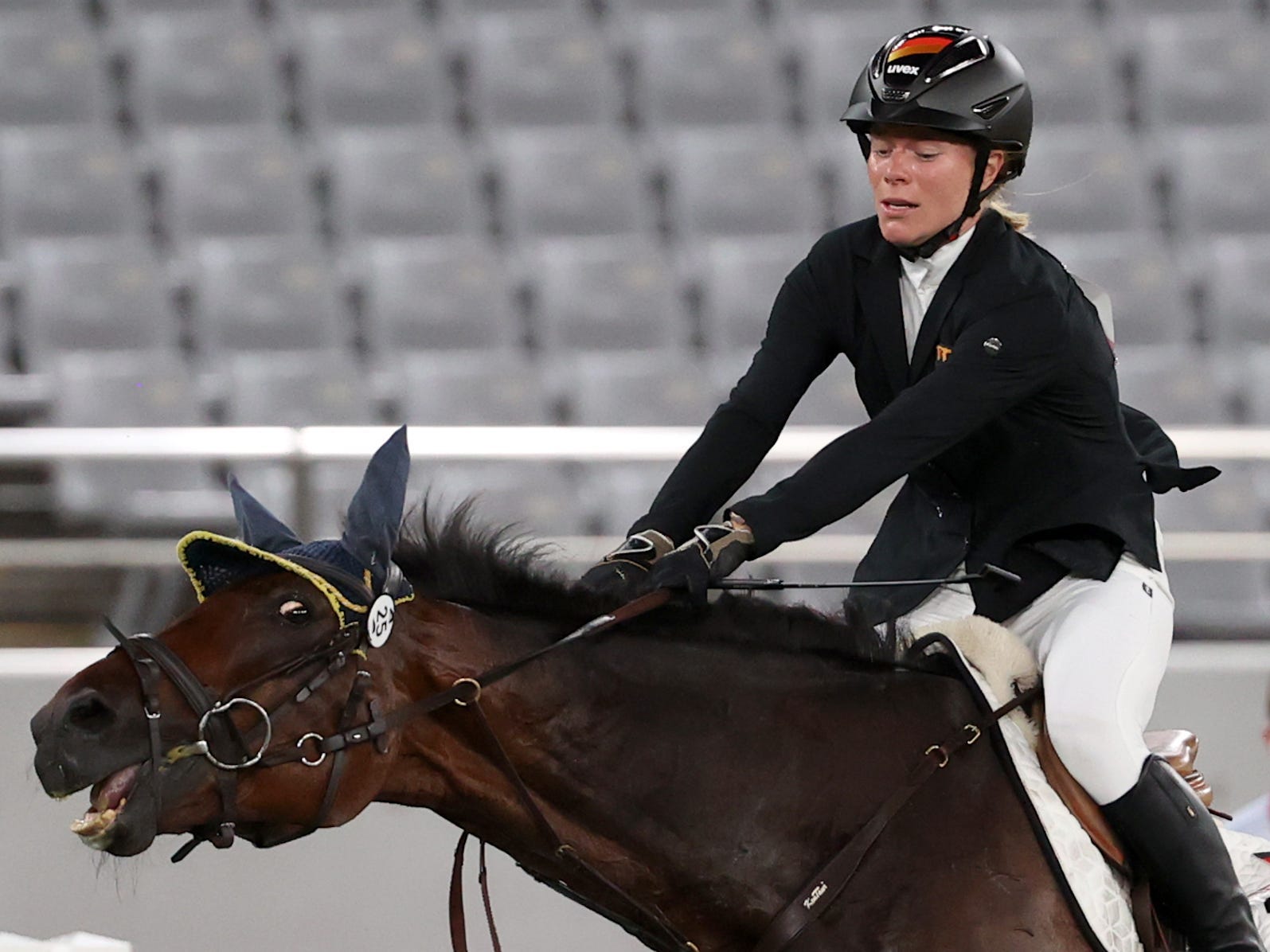 Germany's Annika Schleu competes in the women's individual riding show jumping event during the modern pentathlon competition at the 2020 Summer Olympic Games