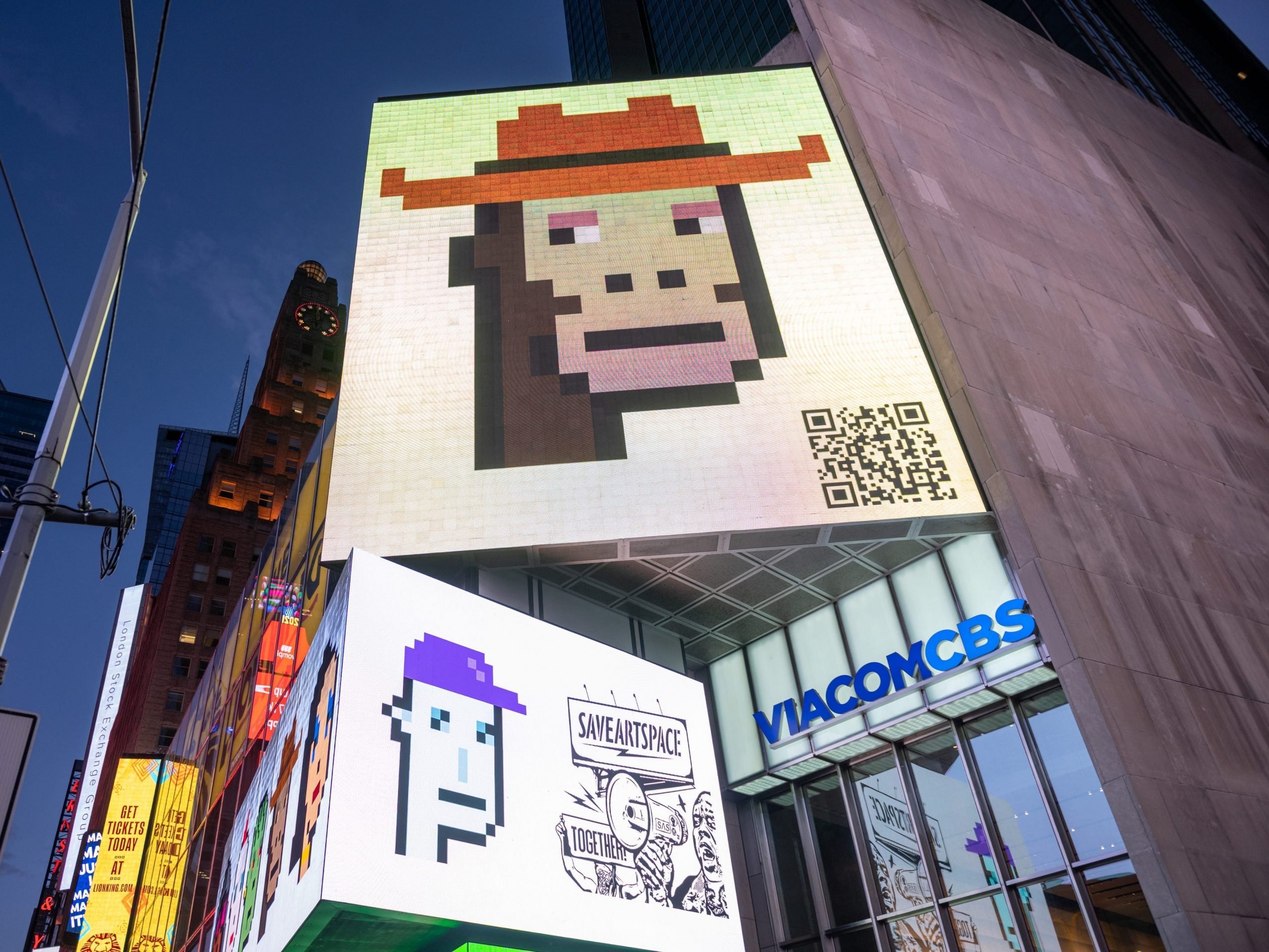 CryptoPunk digital art non-fungible token (NFT) displayed on a digital billboard in Times Square on May 12, 2021 in New York City.