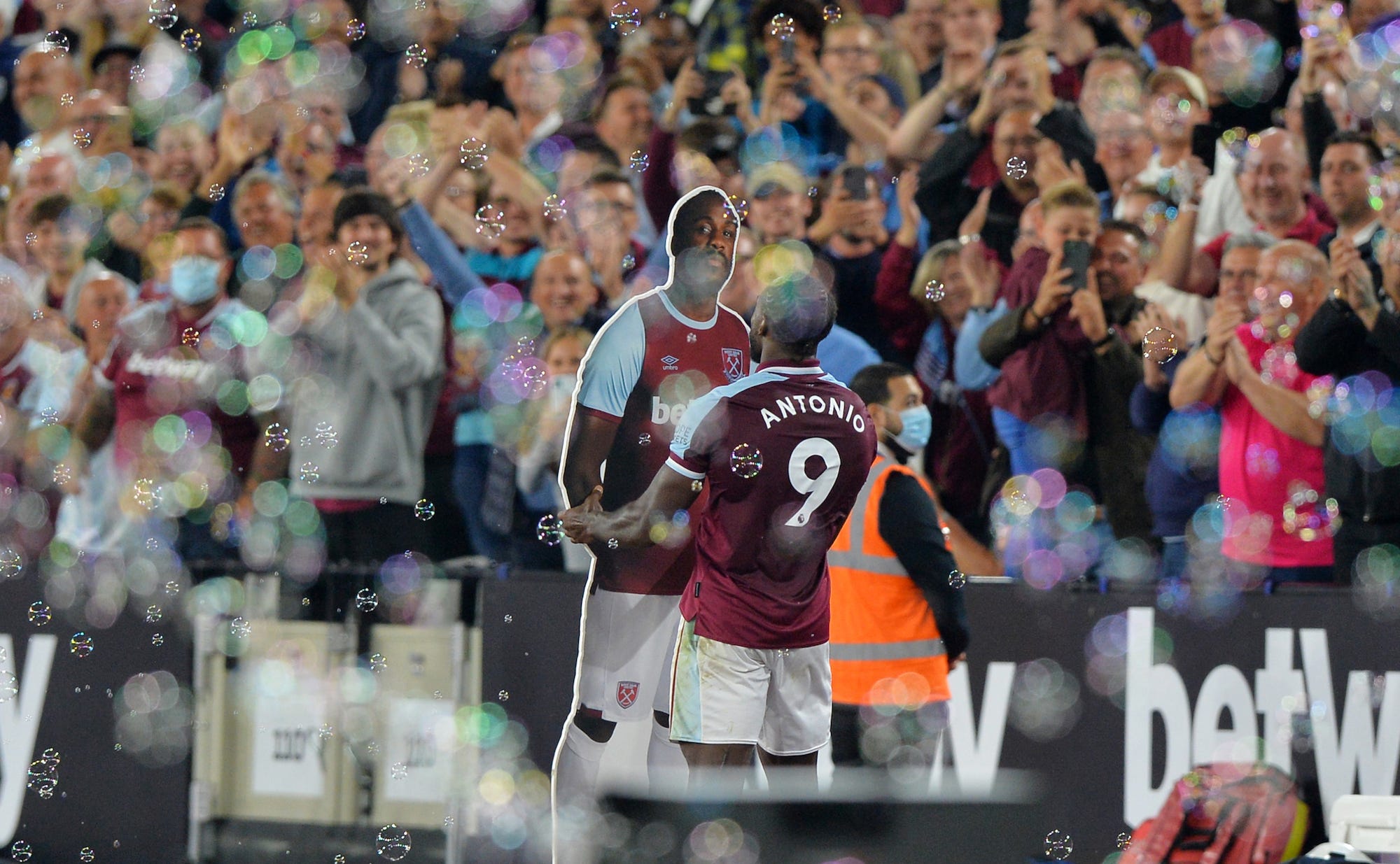Michail Antonio of West Ham United celebrates with a cardboard cut out of himself after scoring to make it 4-1 during the Premier League match between West Ham United and Leicester City at The London Stadium
