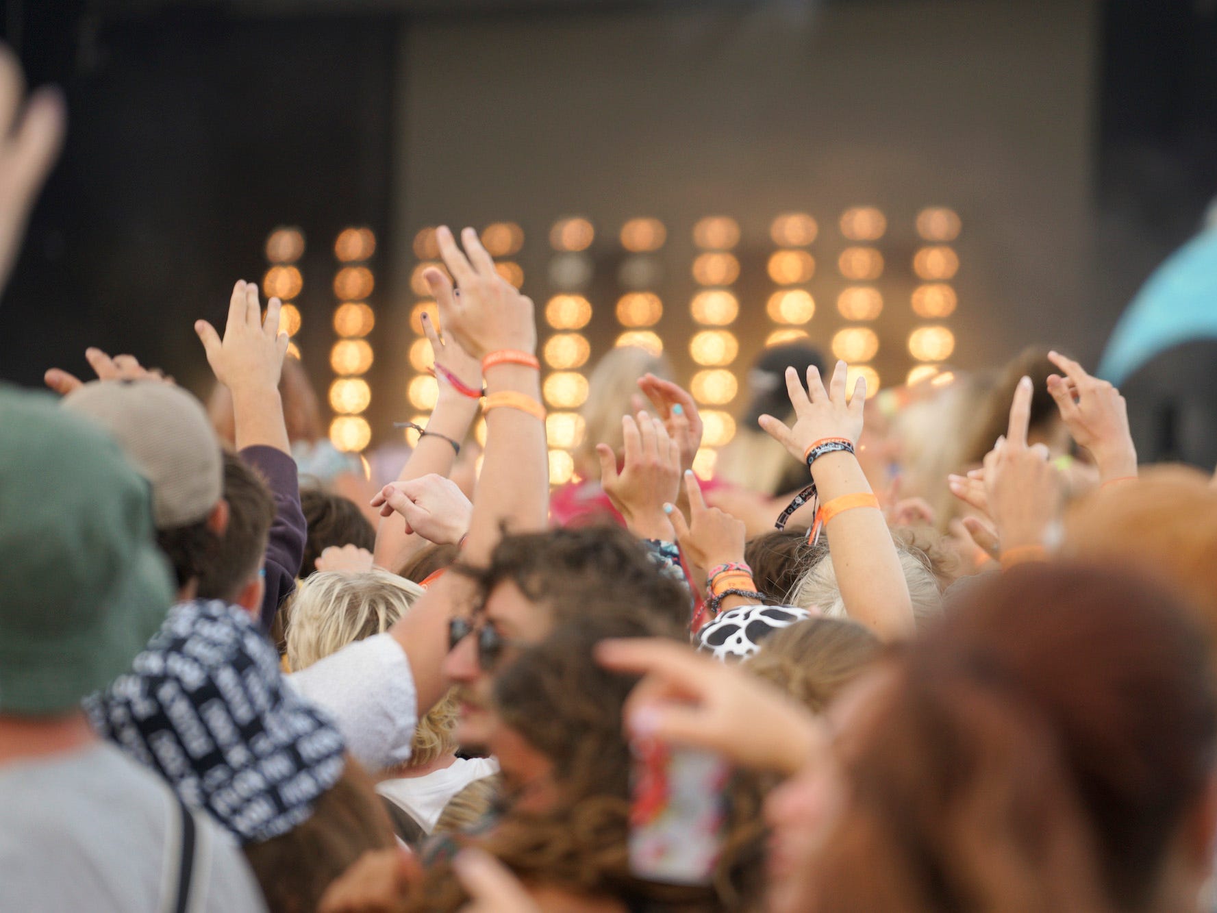 A shot of a crowd from the back looking at a stage at the Boardmasters festival.