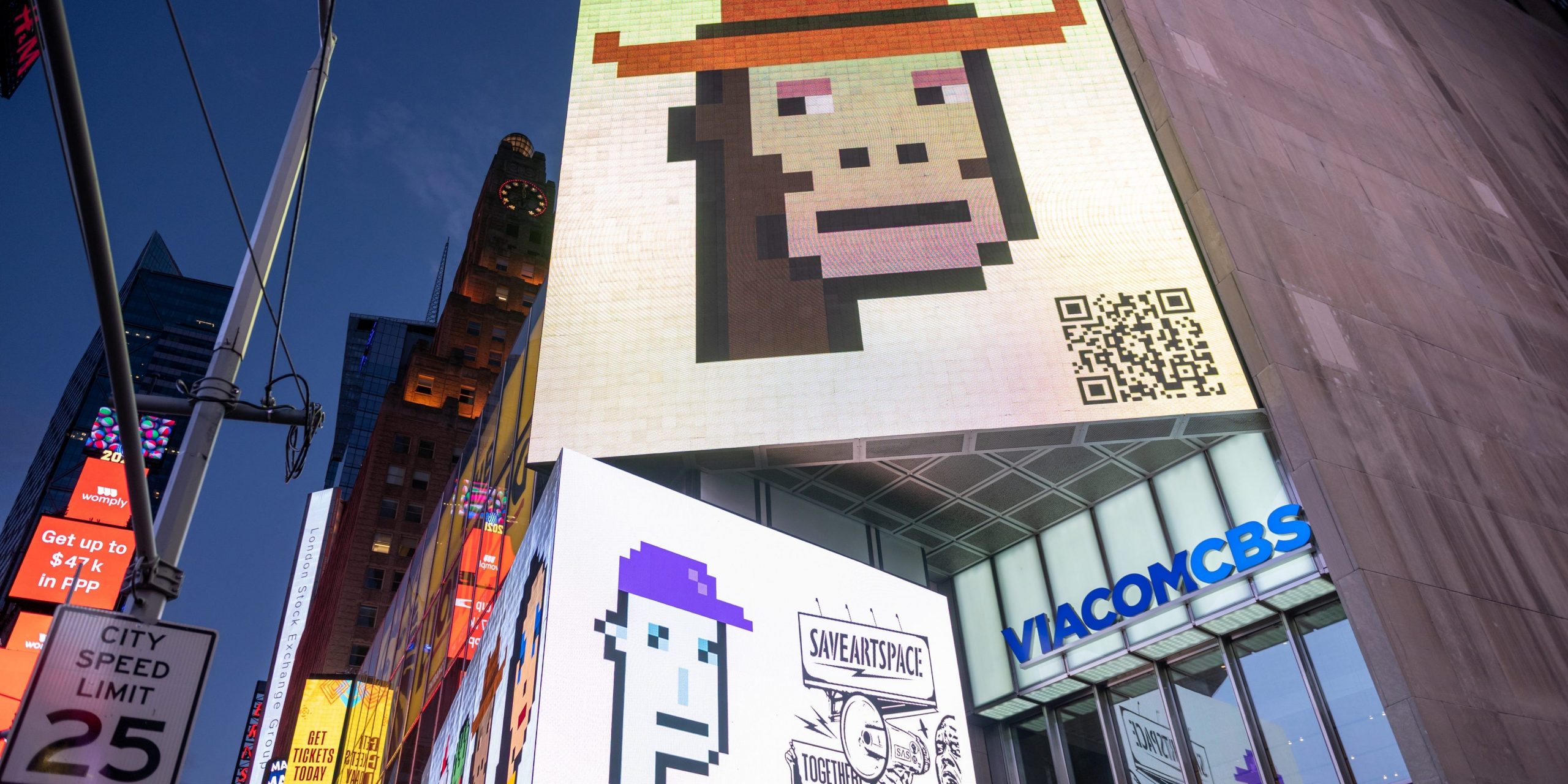 CryptoPunk digital art non-fungible token (NFT) displayed on a digital billboard in Times Square on May 12, 2021 in New York City.