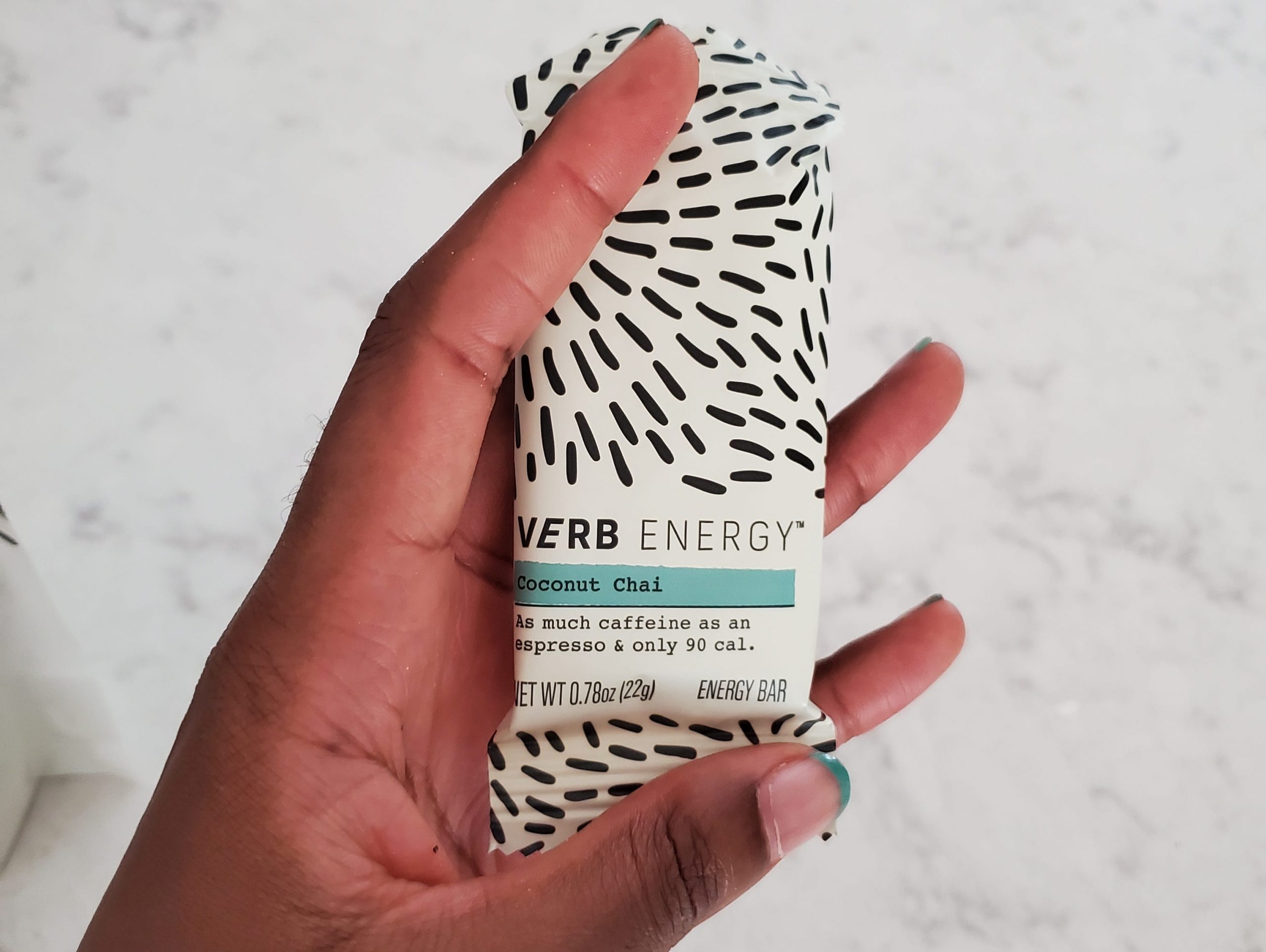 hand holding verb energy bar