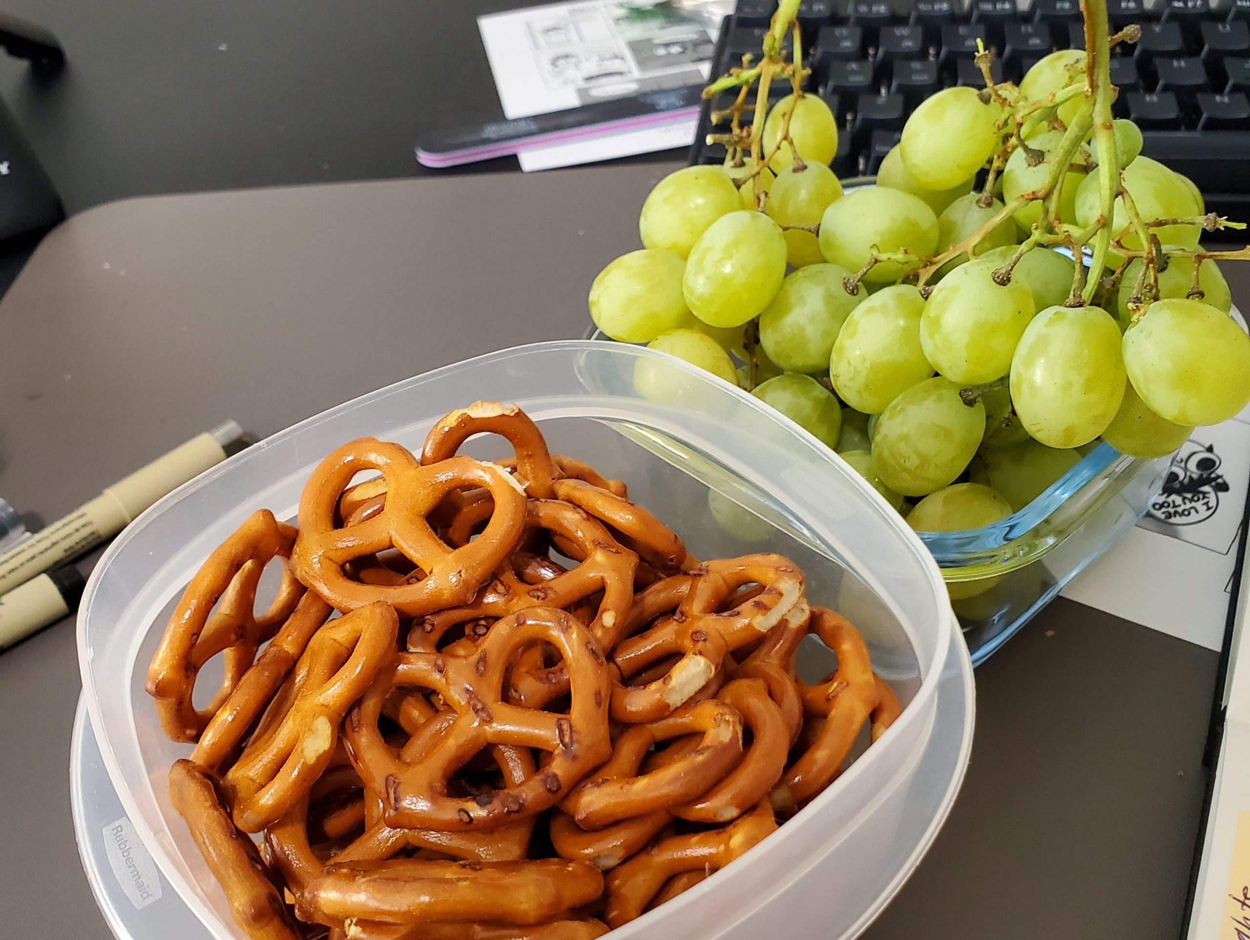 pretzels and grapes sitting on counter