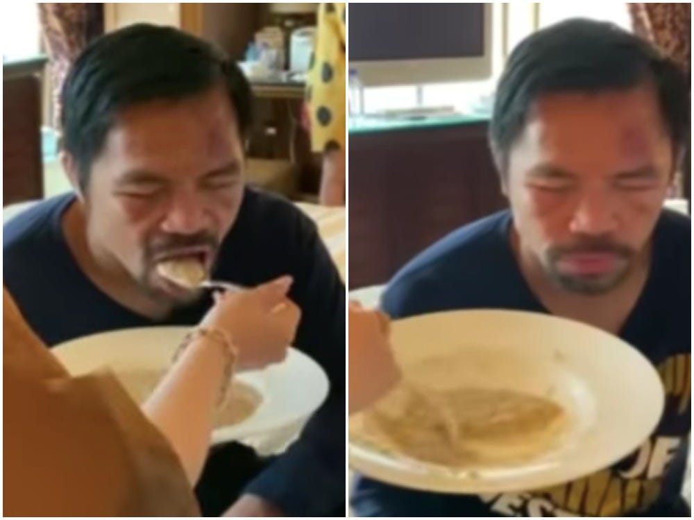 Jinkee Pacquiao spoon-feeds her husband Manny Pacquiao, who keeps his eyes shut while eating, three days after his recent boxing loss to Yordenis Ugas.