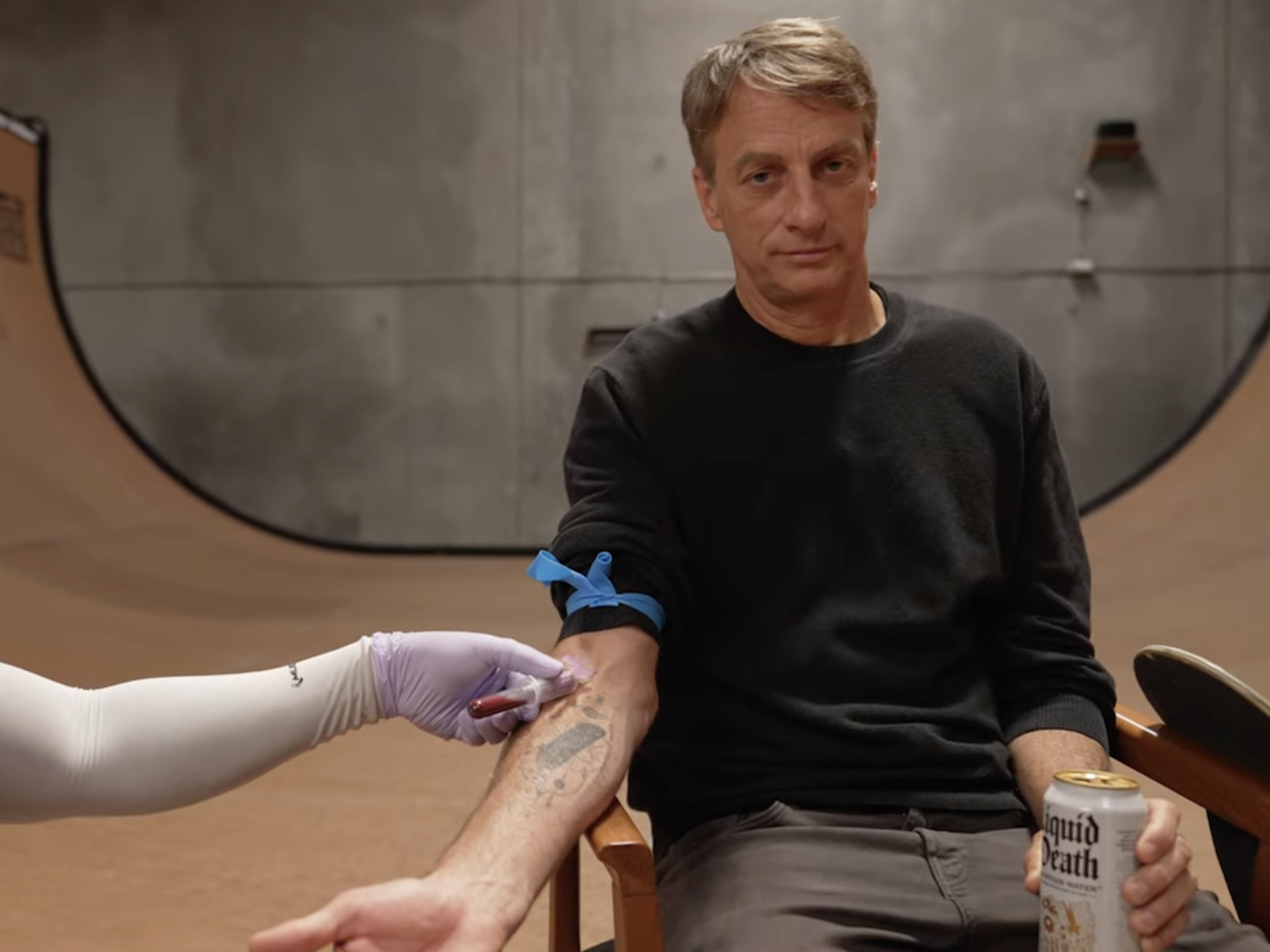 Tony Hawk having blood taken to be painted on a skateboarder