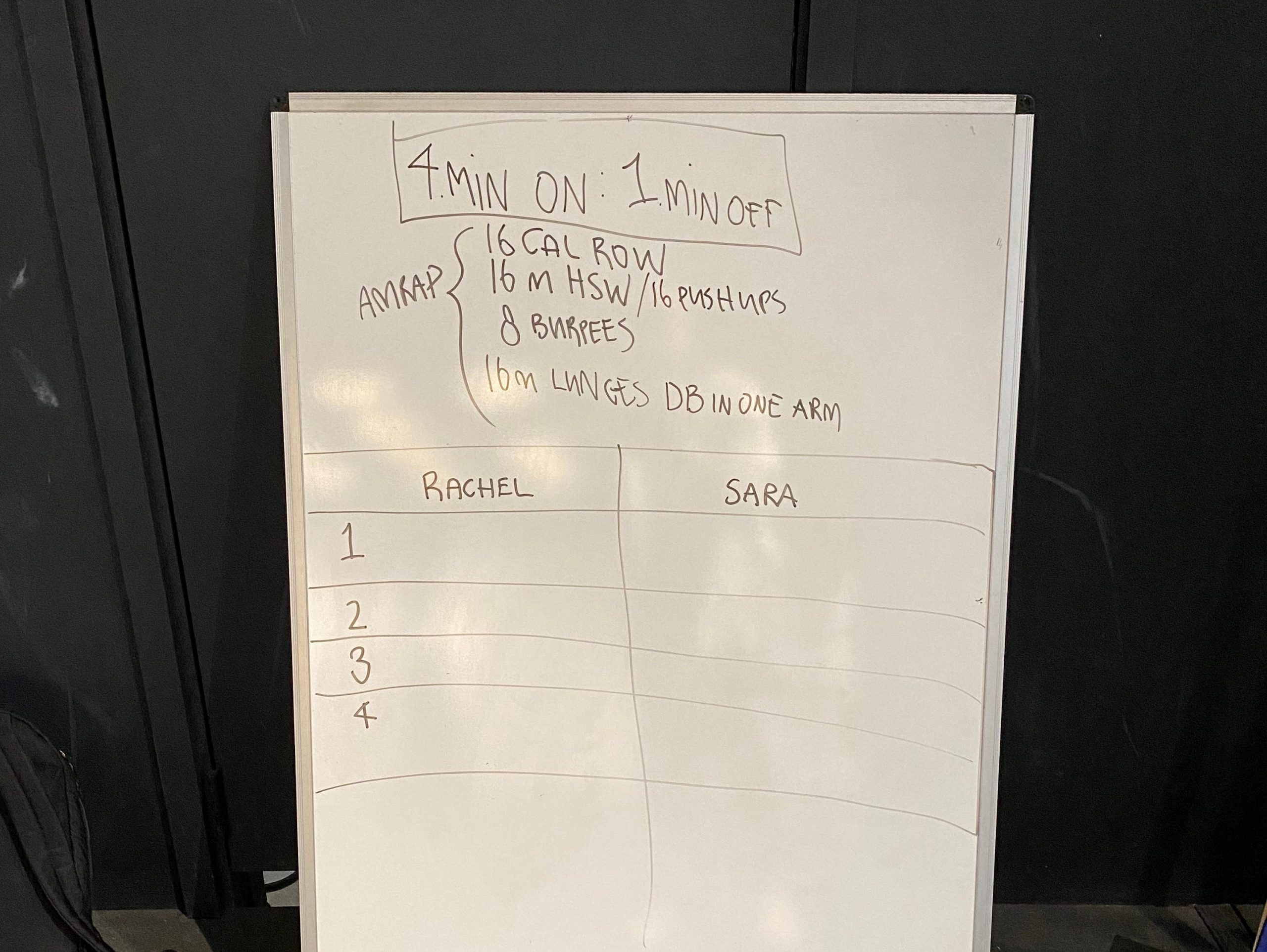 A whiteboard with a workout written on.