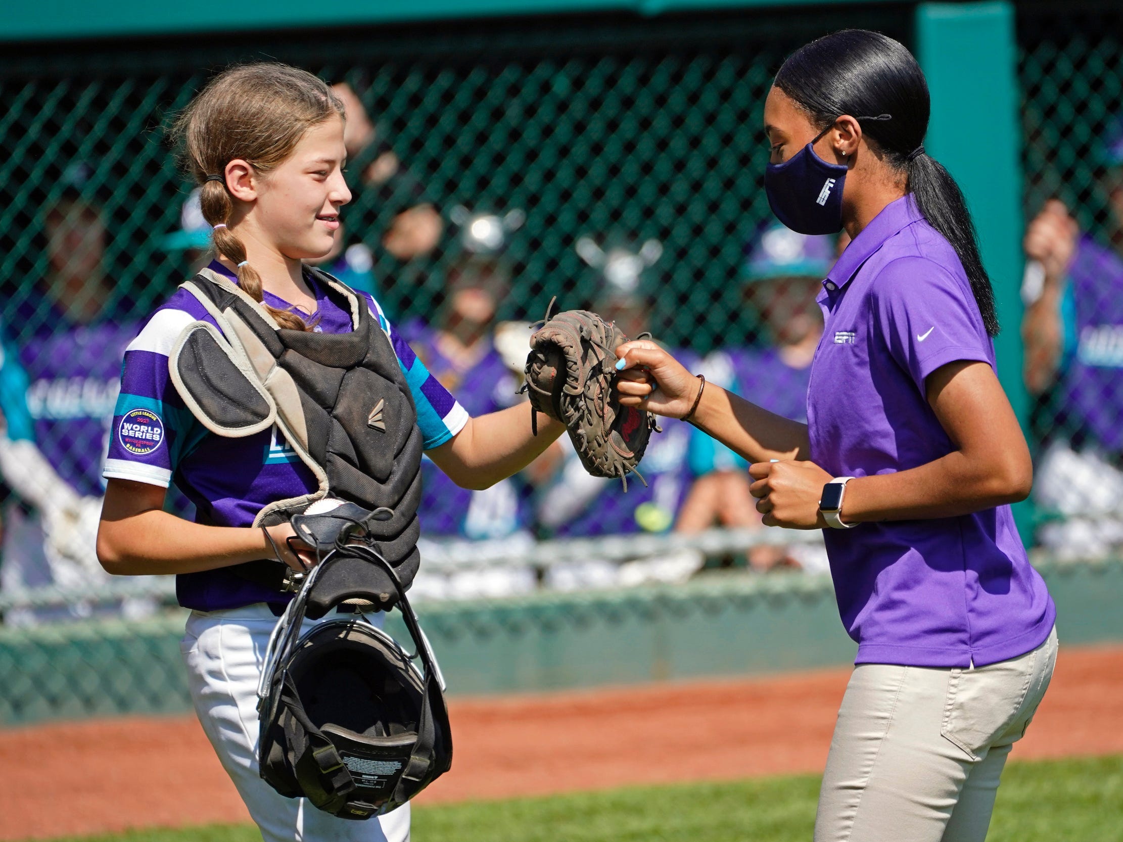 Mo'ne Davis (right) and Ella Bruning fist bump at the Little League World Series.