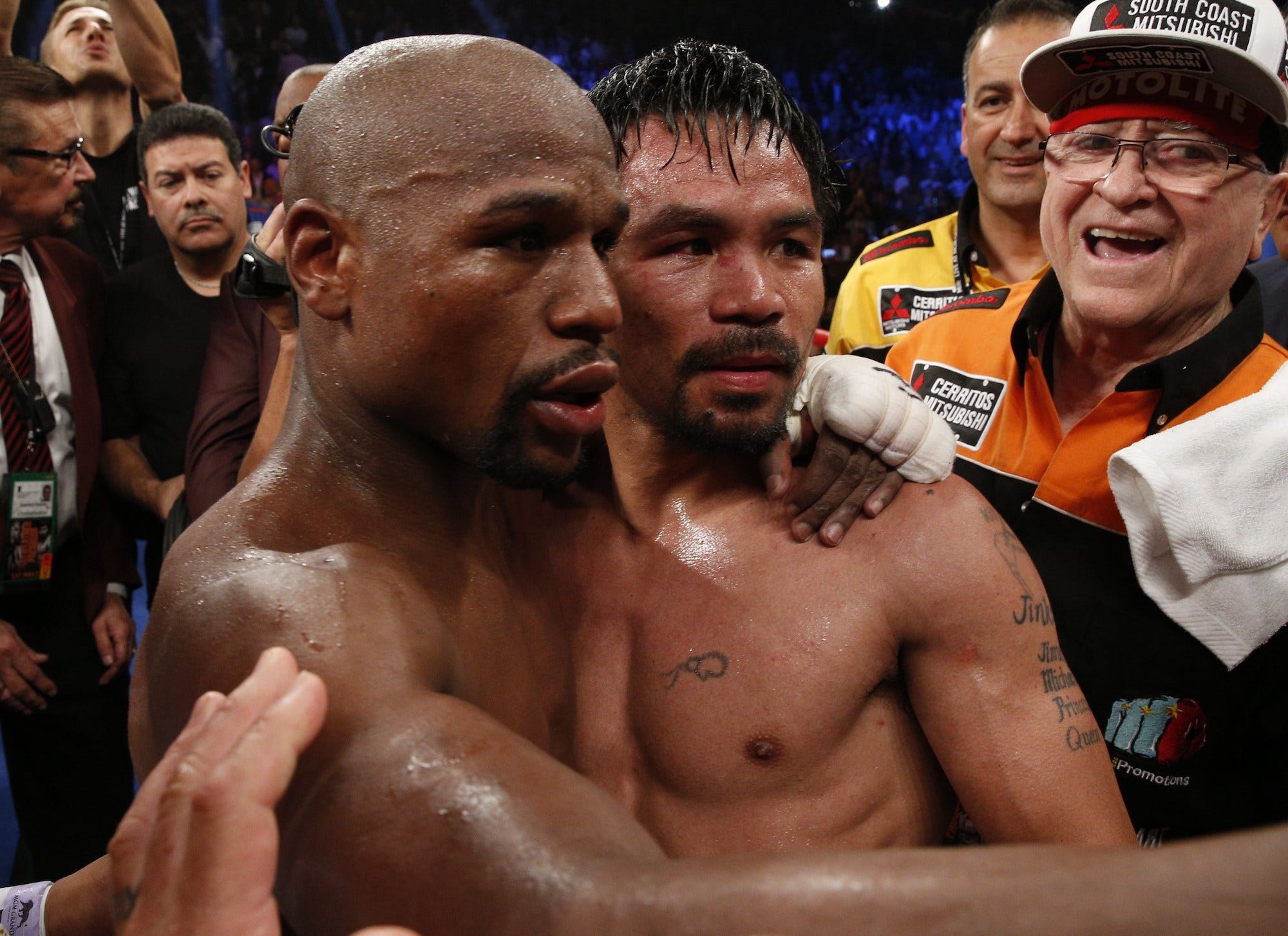 Floyd Mayweather and Manny Pacquiao embraced after their 2015 fight.