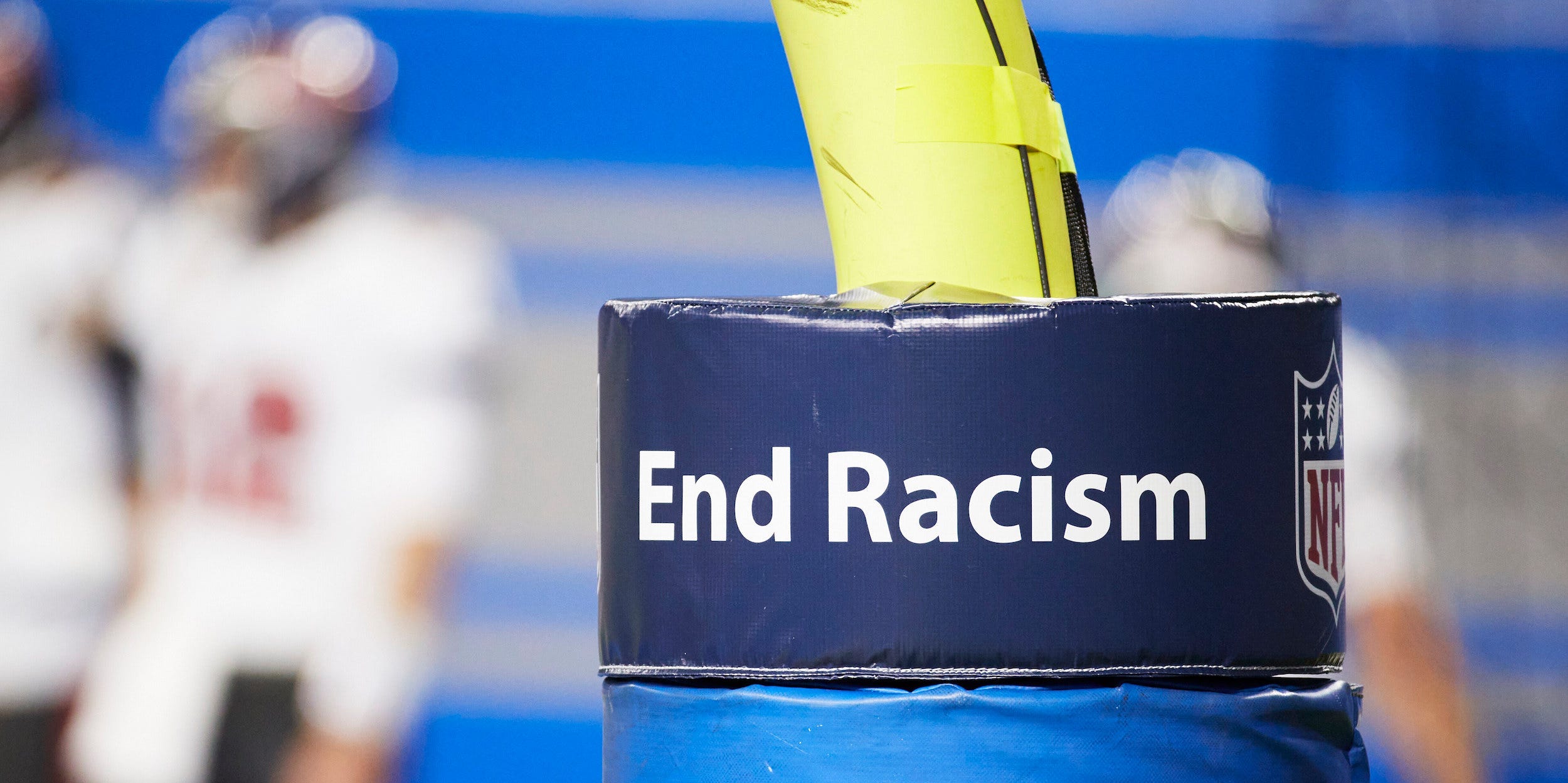 End Racism on the goal post pad during an NFL football game between the Tampa Bay Buccaneers and Detroit Lions, Saturday, Dec. 26, 2020, in Detroit.