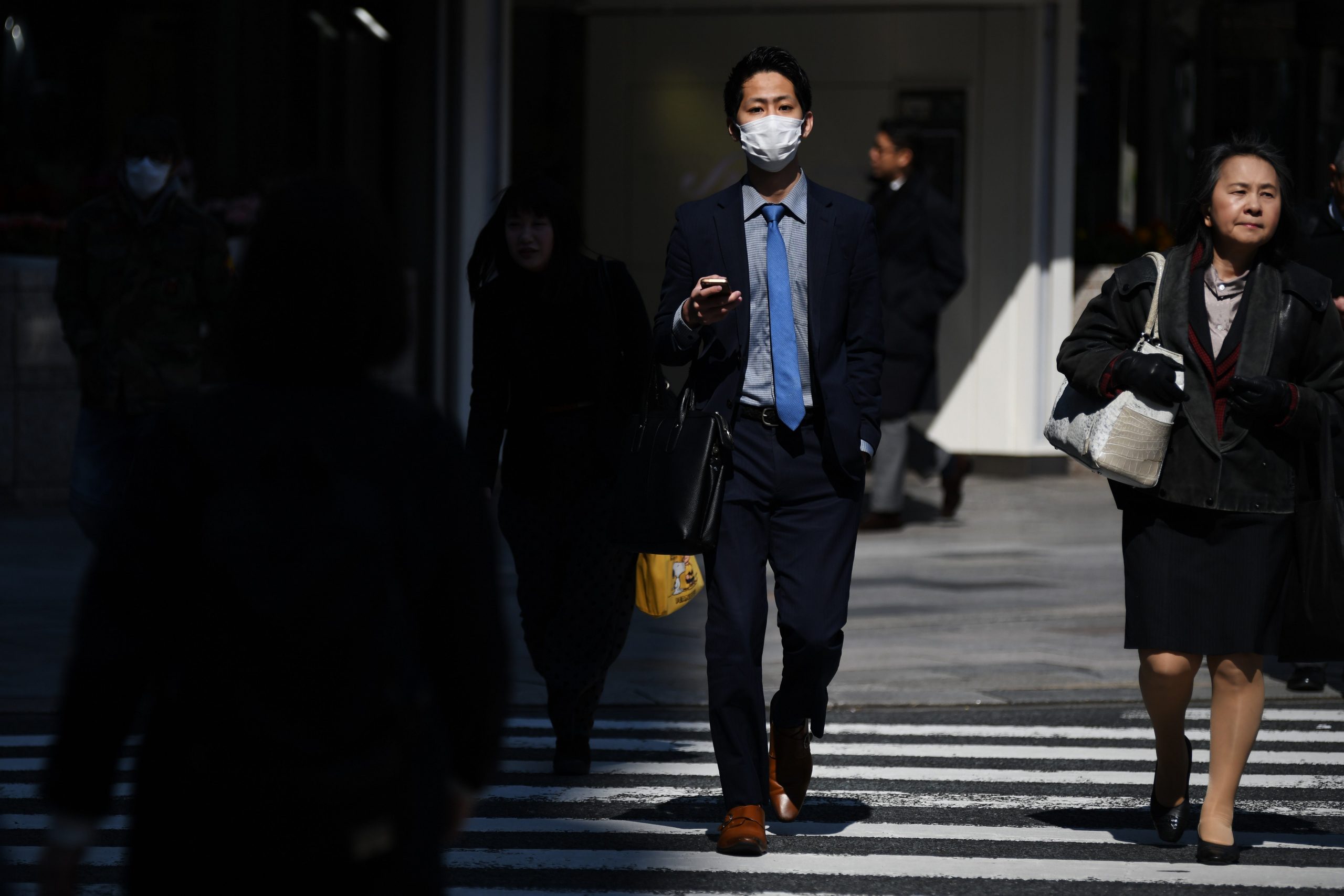 Japanese office workers crossing street