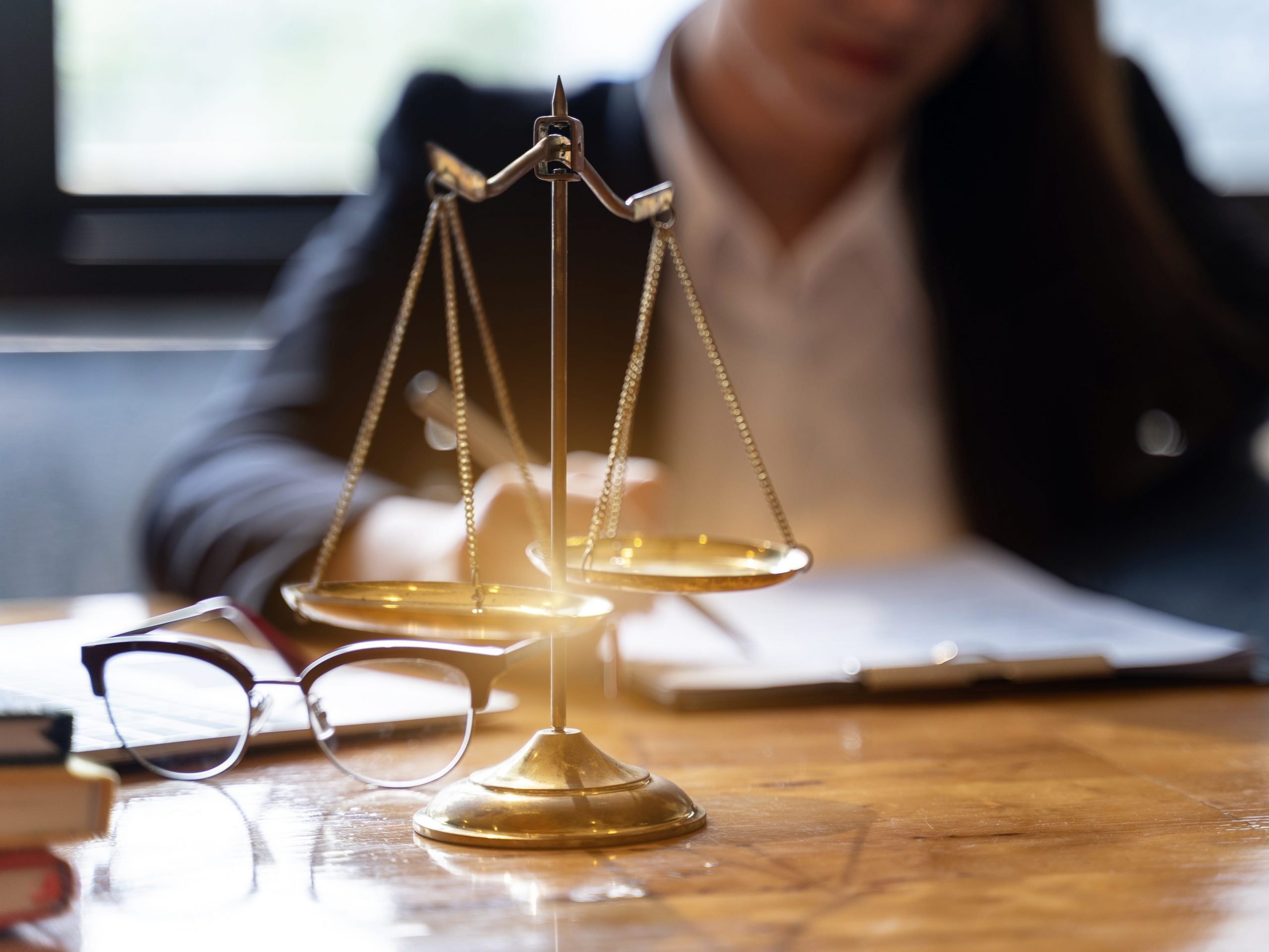 Midsection Of Lawyer Working At Desk In Courtroom