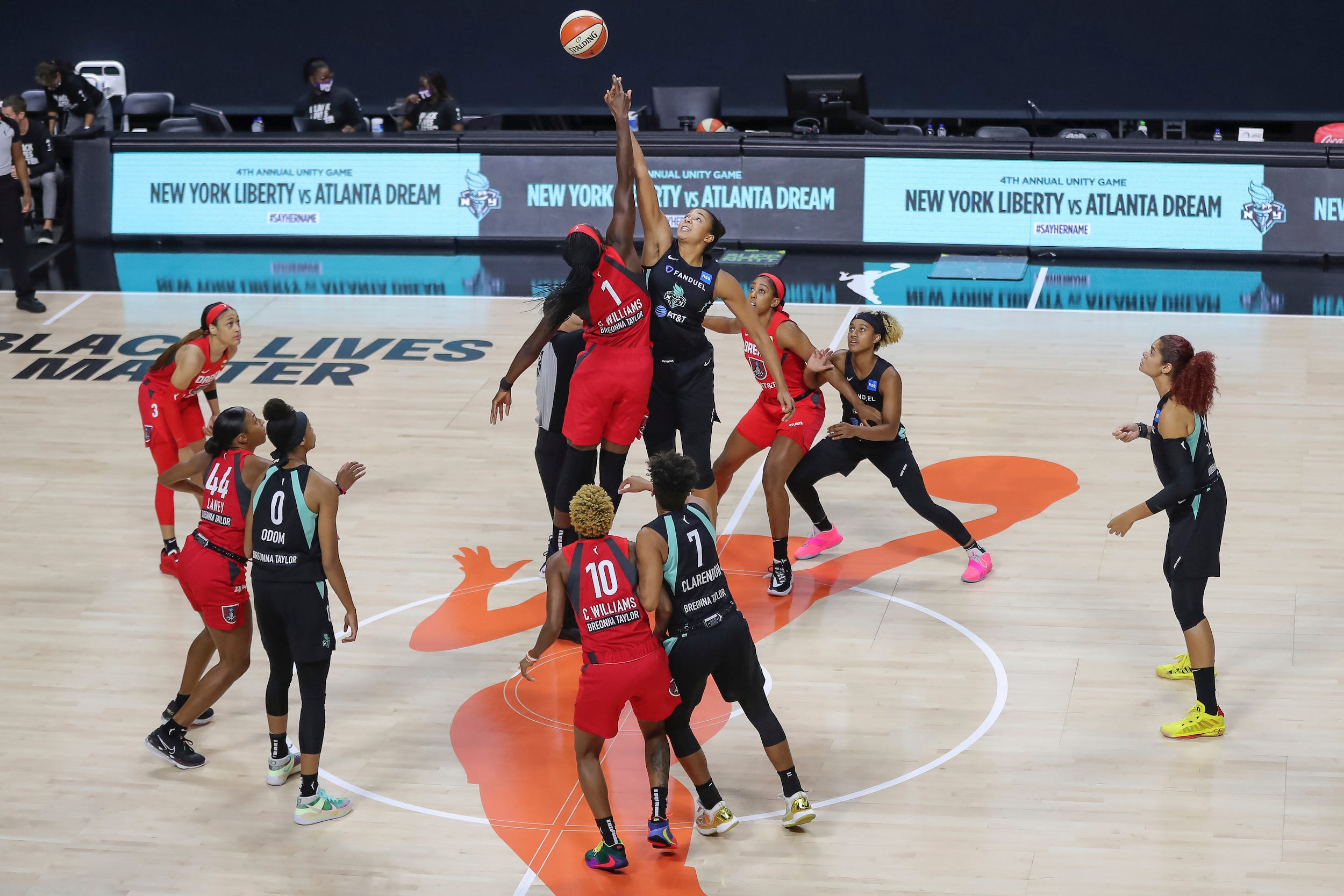 A WNBA game tips off between the Atlanta Dream and New York Liberty.