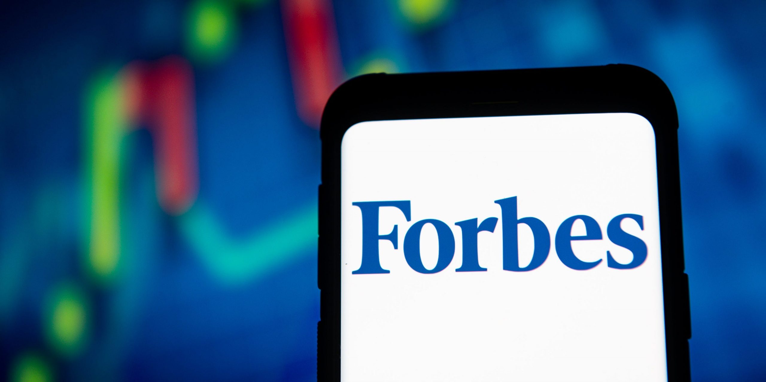 In this photo illustration a Forbes logo seen displayed on a smartphone.