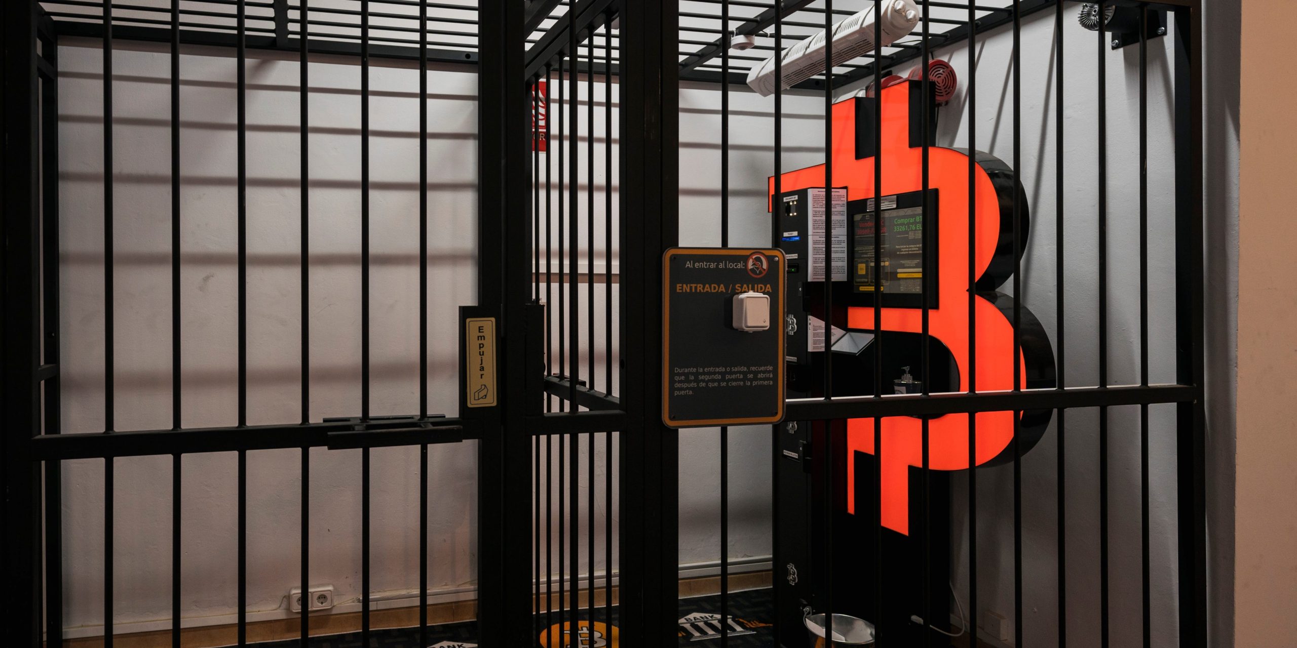 A bitcoin ATM machine, to buy or sell cryptocurrencies, is placed within a safety cage on January 29, 2021 in Barcelona, Spain.