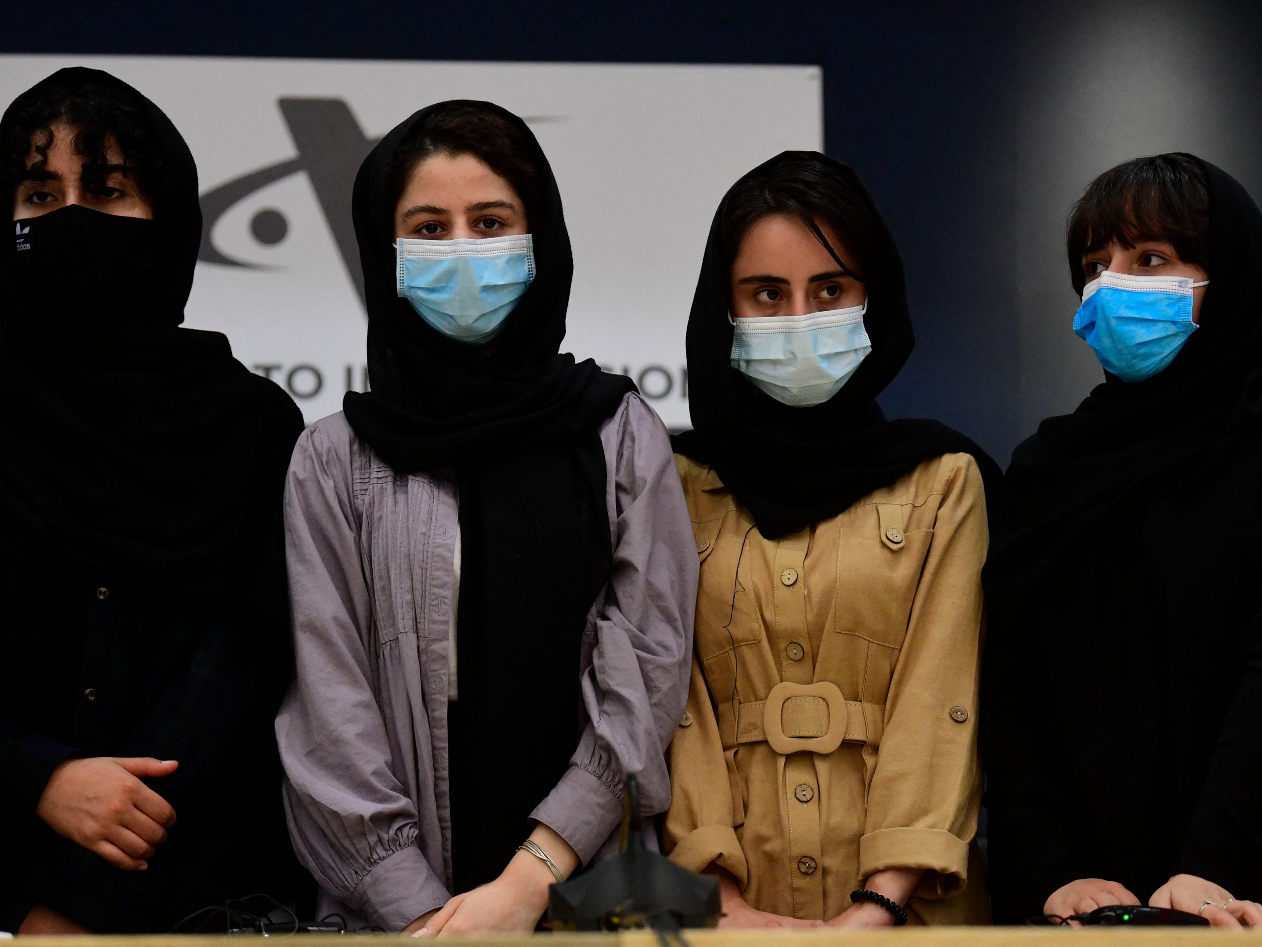Four Afghan women, members of the Afghanistan Robotic team, pose for a picture during their arrival to Mexico after asking for refuge, at the Benito Juarez International Airport in Mexico City, on August 24, 2021