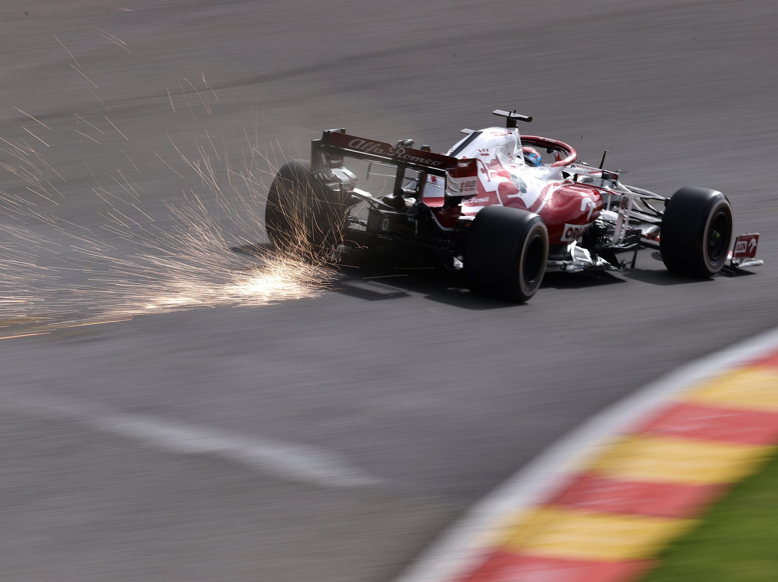 Sparks fly behind Kimi Raikkonen