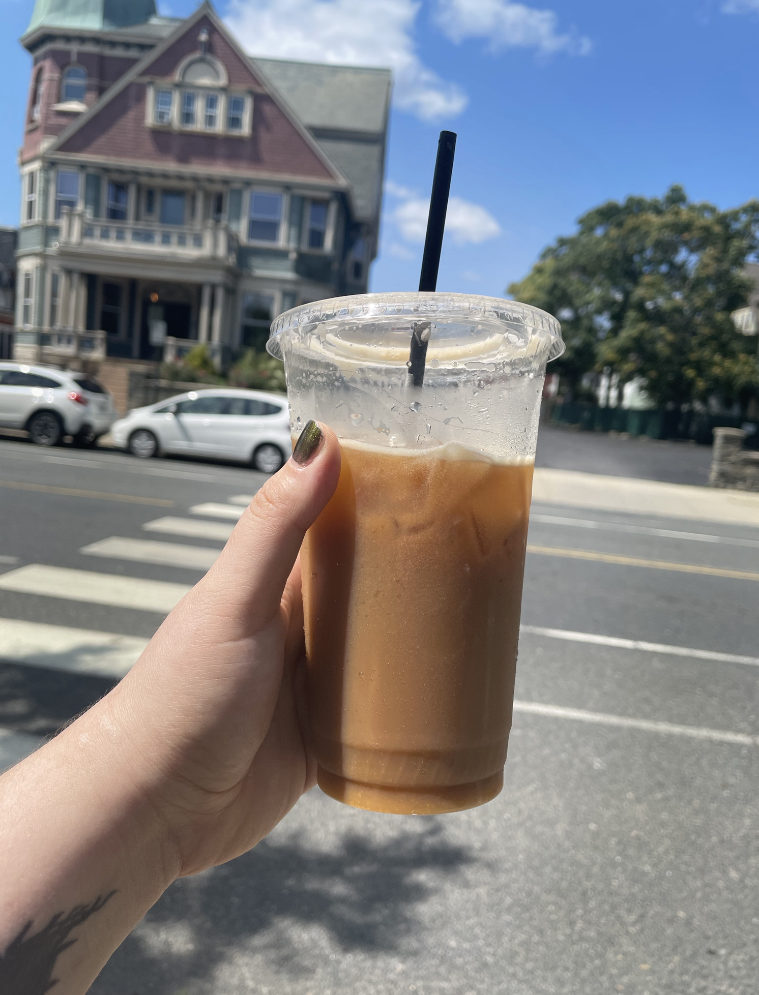 hand holding iced coffee from nitro cart in providence rhode island