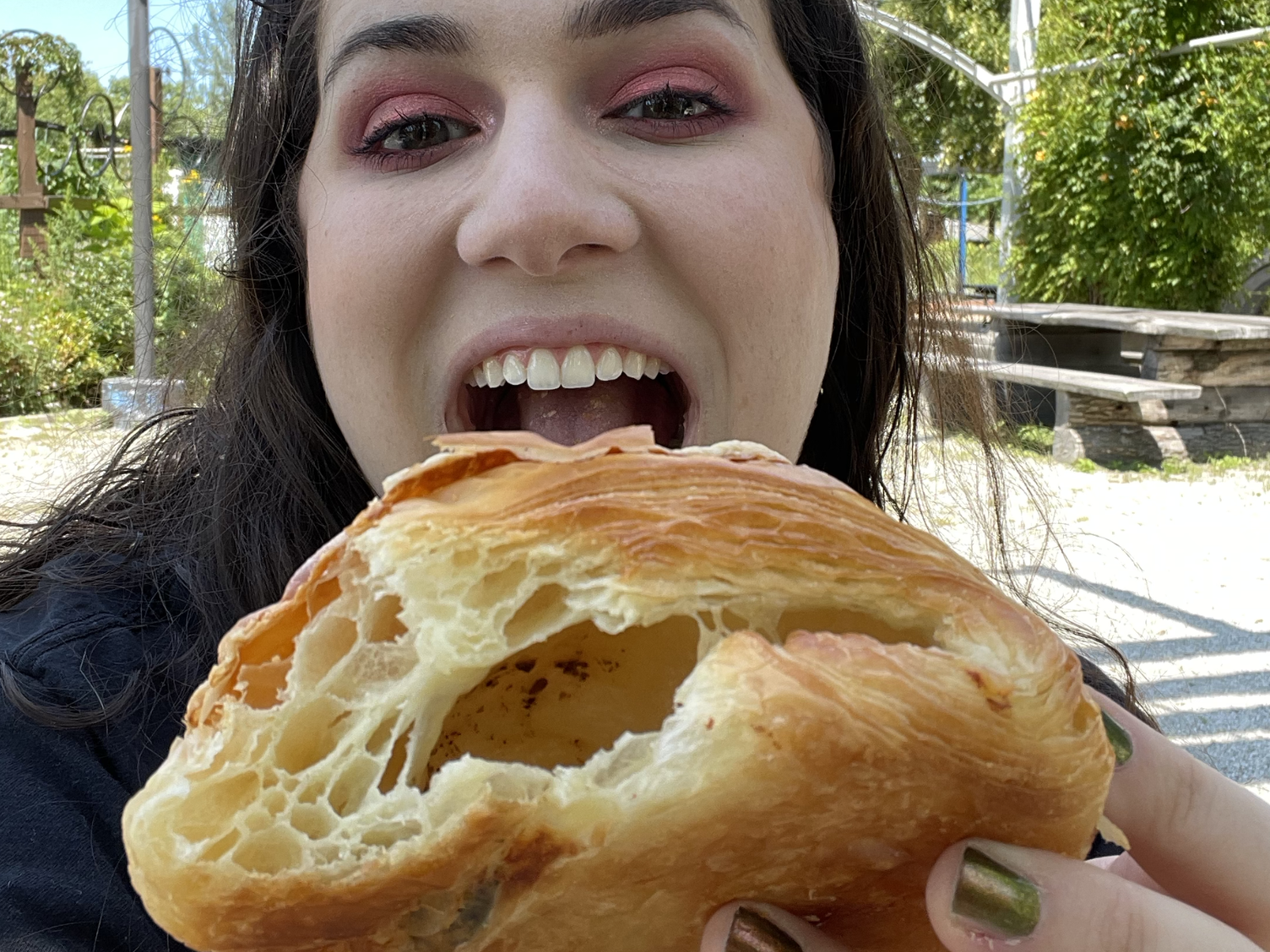 woman holding a croissant from butterbang in providence rhode island