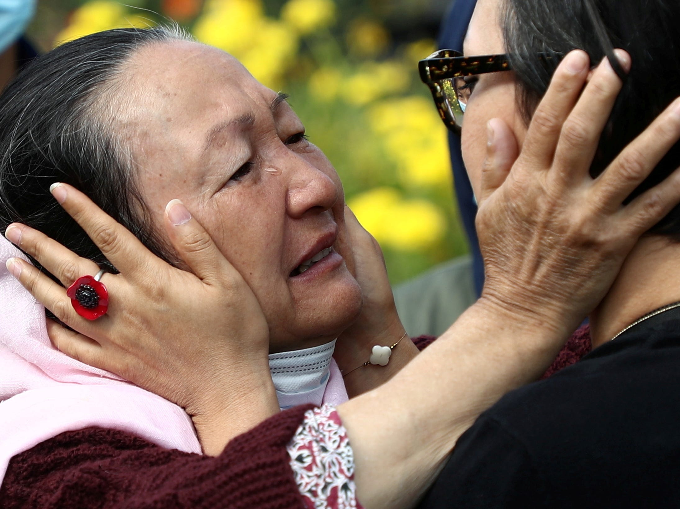 Shakiba Dawod, an Afghan artist who lives in France since 2009, kisses her mother Qadira as they reunite for the first time in 12 years, following Shakiba?s family evacuation from Afghanistan, in front of a reception centre in Pantin, near Paris, France, August 27, 2021.