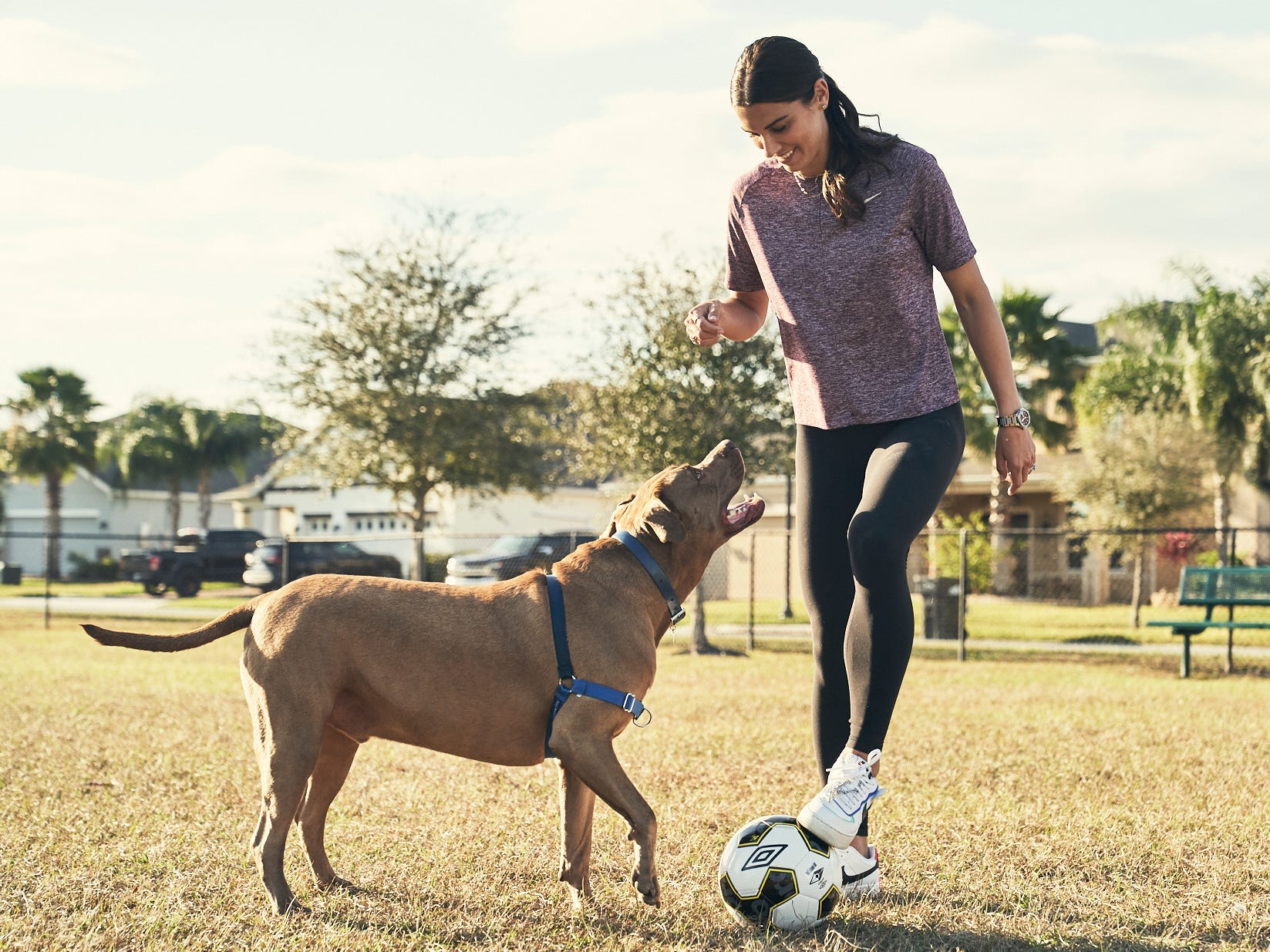 Alex Morgan plays soccer with her dog, Blue.