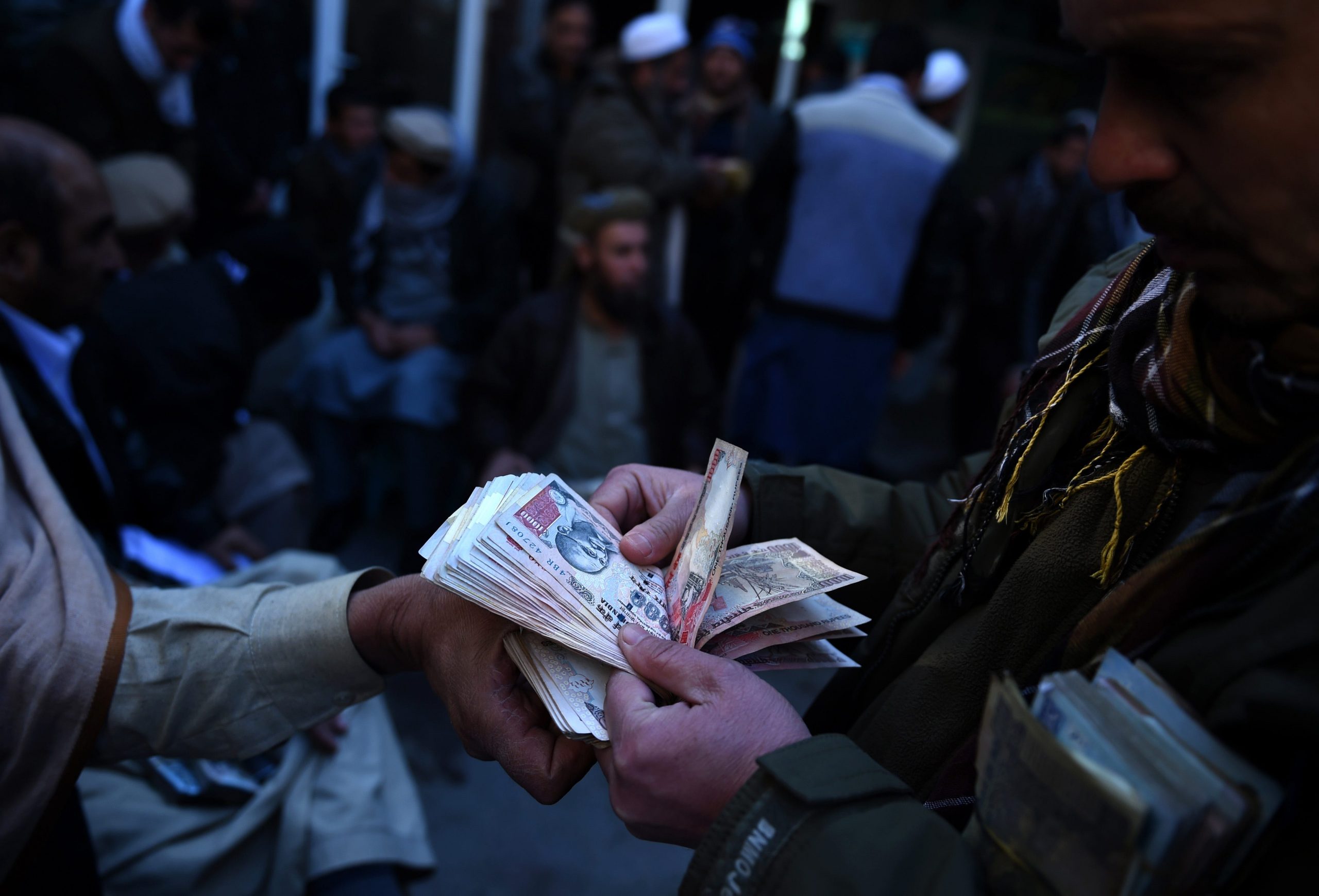 Afghan money changing hands in a public market