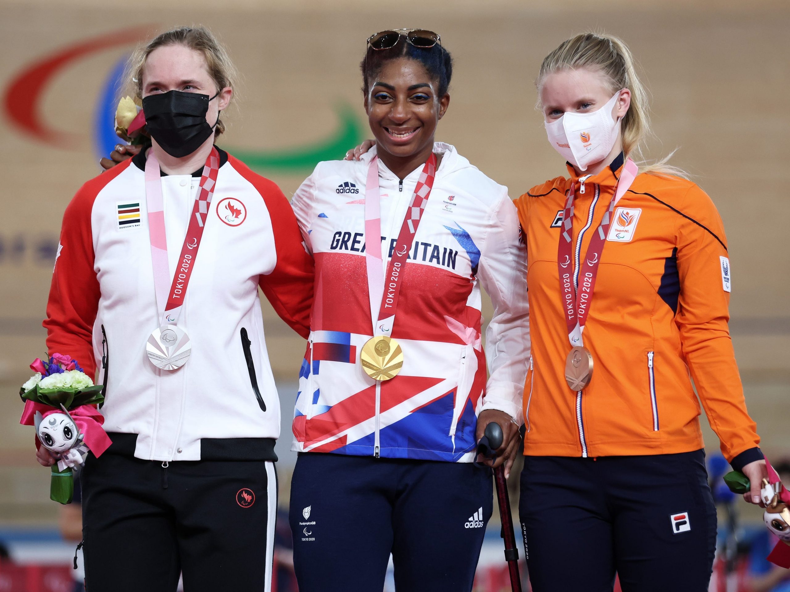 Photo of Silver medalist Kate O'Brien of Team Canada, gold medalist Kadeena Cox of Team Great Britain and bronze medalist Caroline Groot of Team Netherlands at the podium.