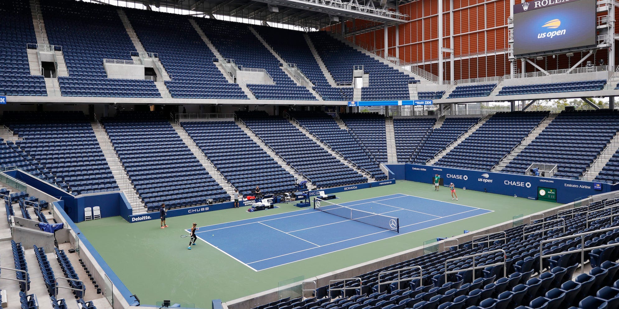 A general view of Louis Armstrong Stadium as Nina Stojanovic of Serbia and Dayana Yastremska of Ukraine rally during a practice day prior to the start of the 2021 US Open at USTA Billie Jean King National Tennis Center on August 28, 2021 in the Queens borough of New York City.