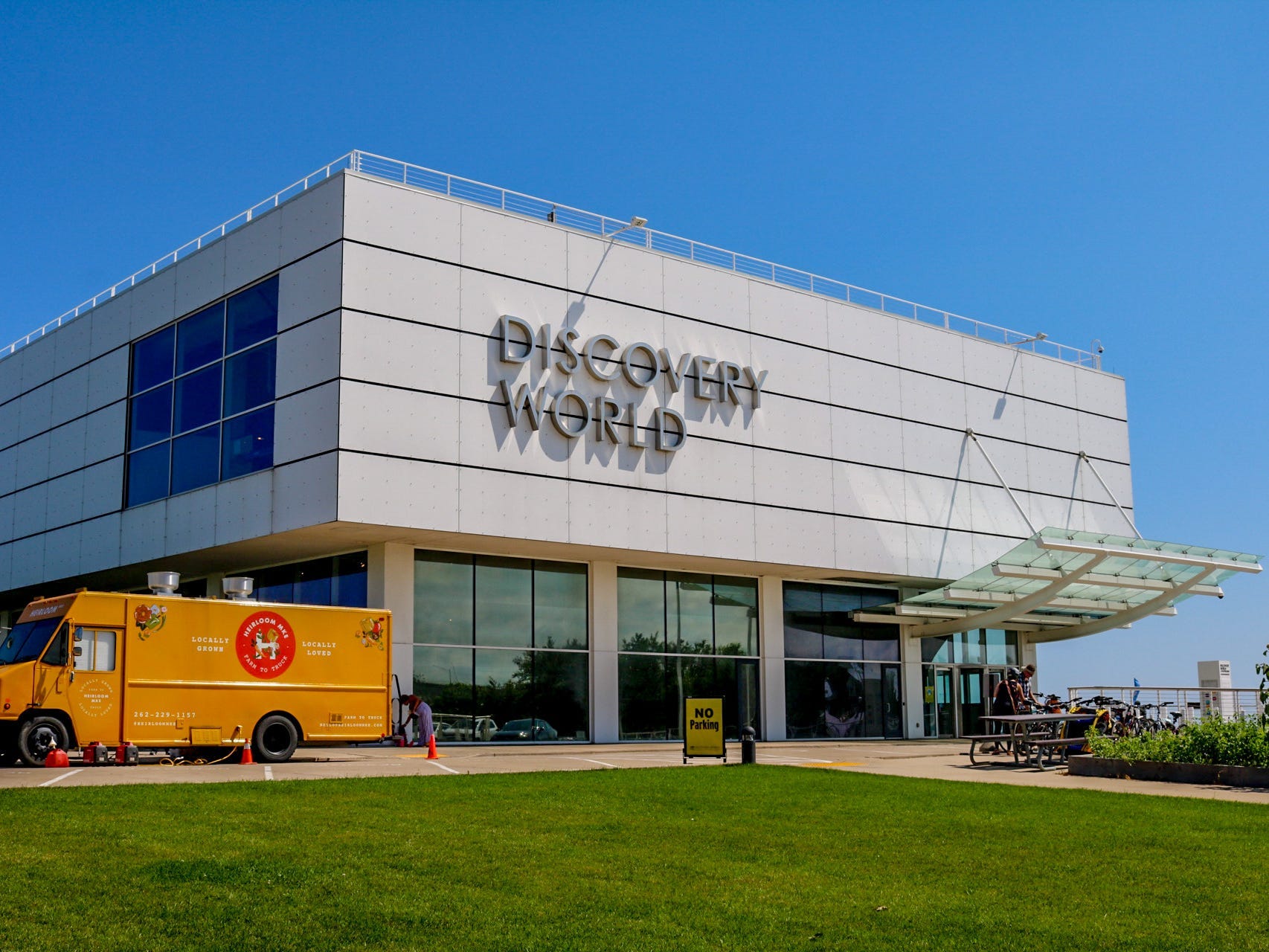 The outside of Discovery World's modern, gray and glass building