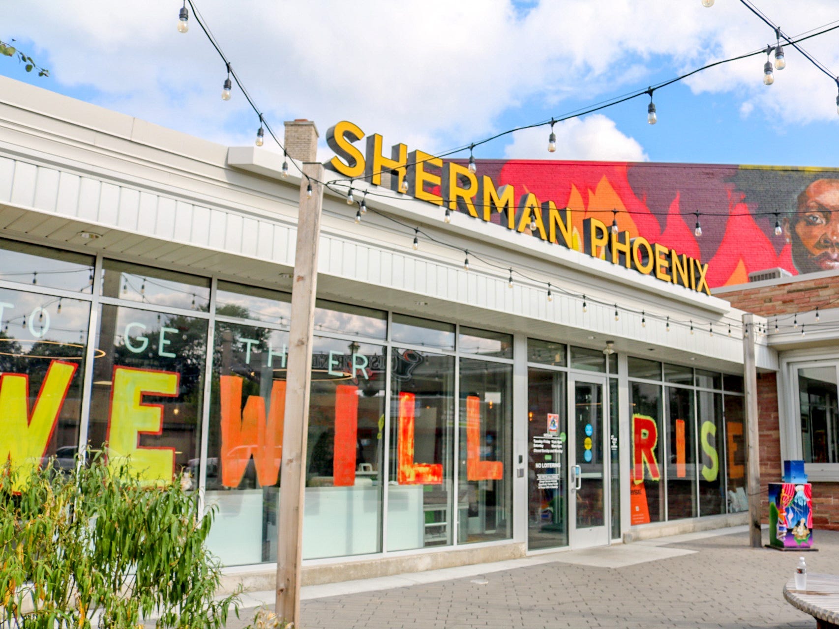 The colorful outside of Sherman Phoenix, with a glass window exterior