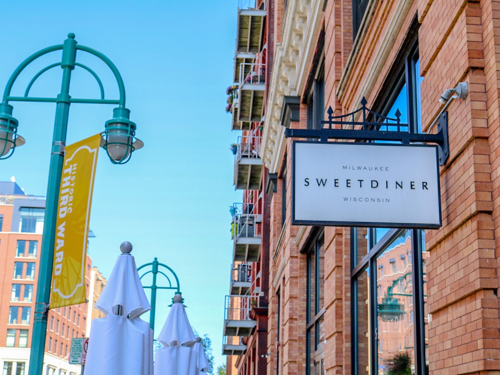 Exterior white sign of Sweet Diner