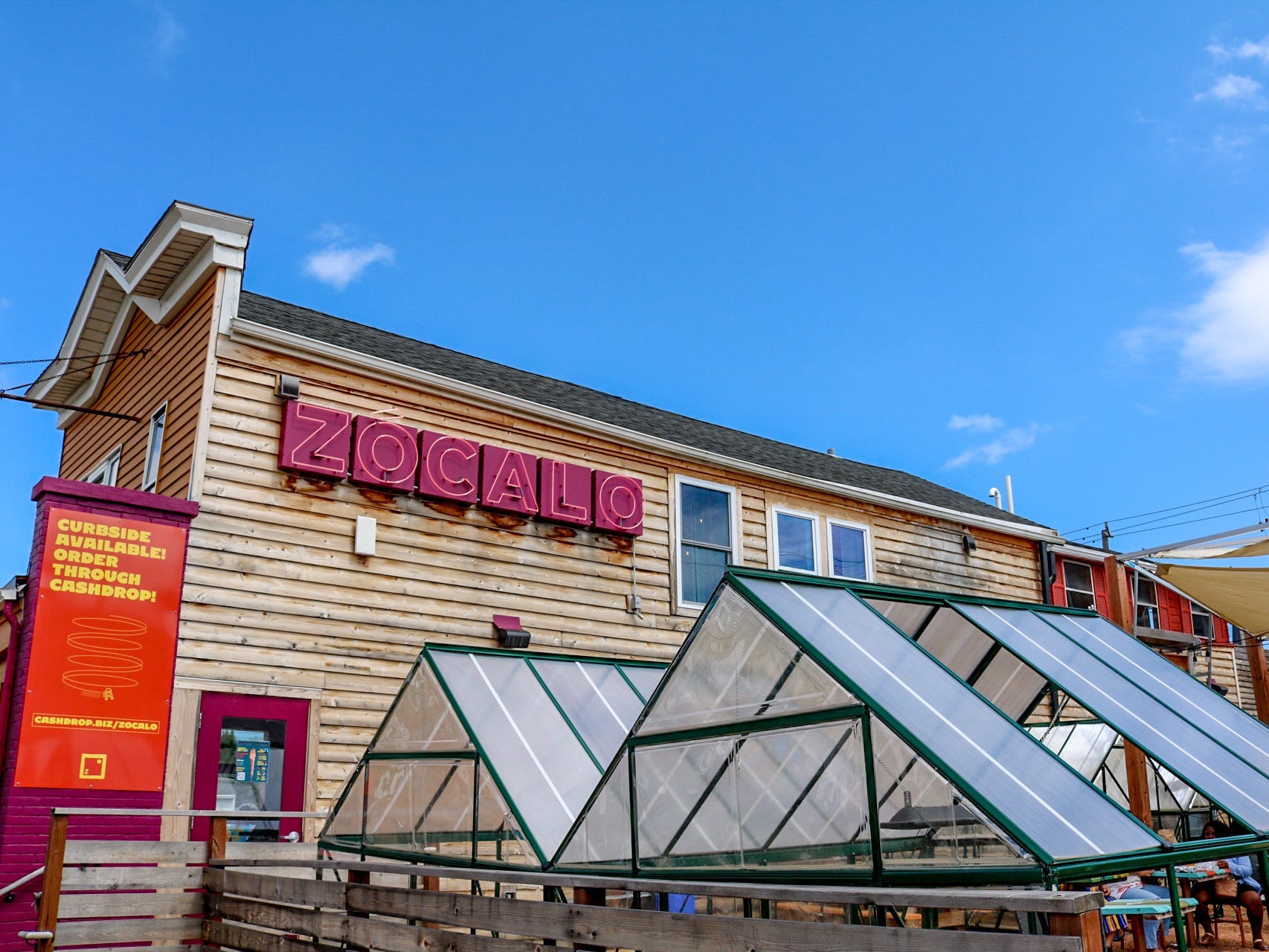 Exterior view of brown and red building of Zócalo Food Park