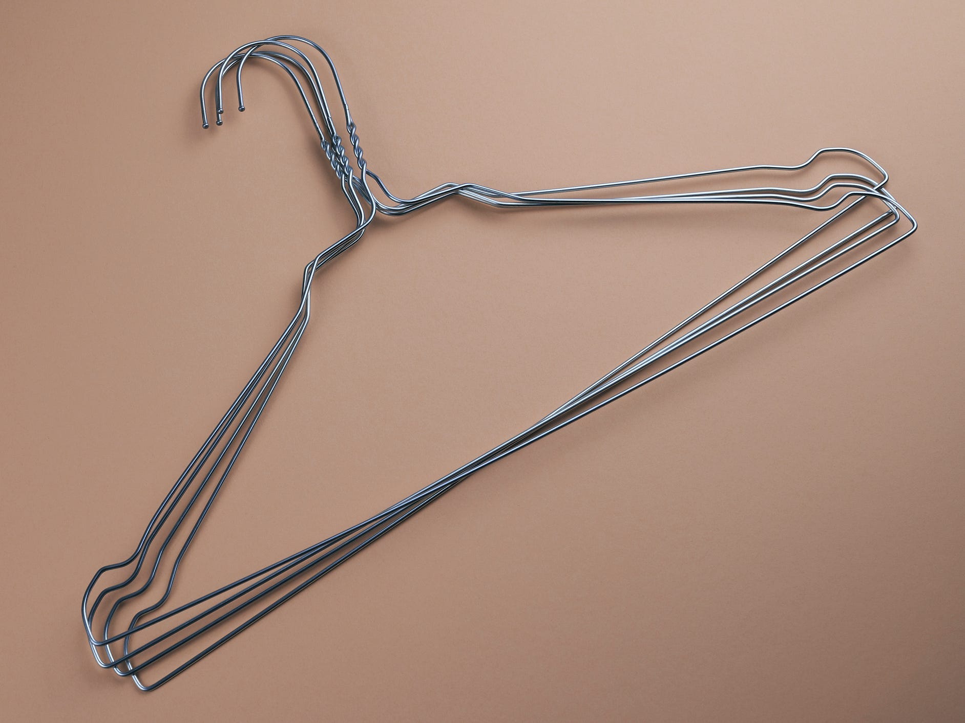 A pile of metal wire hangers.