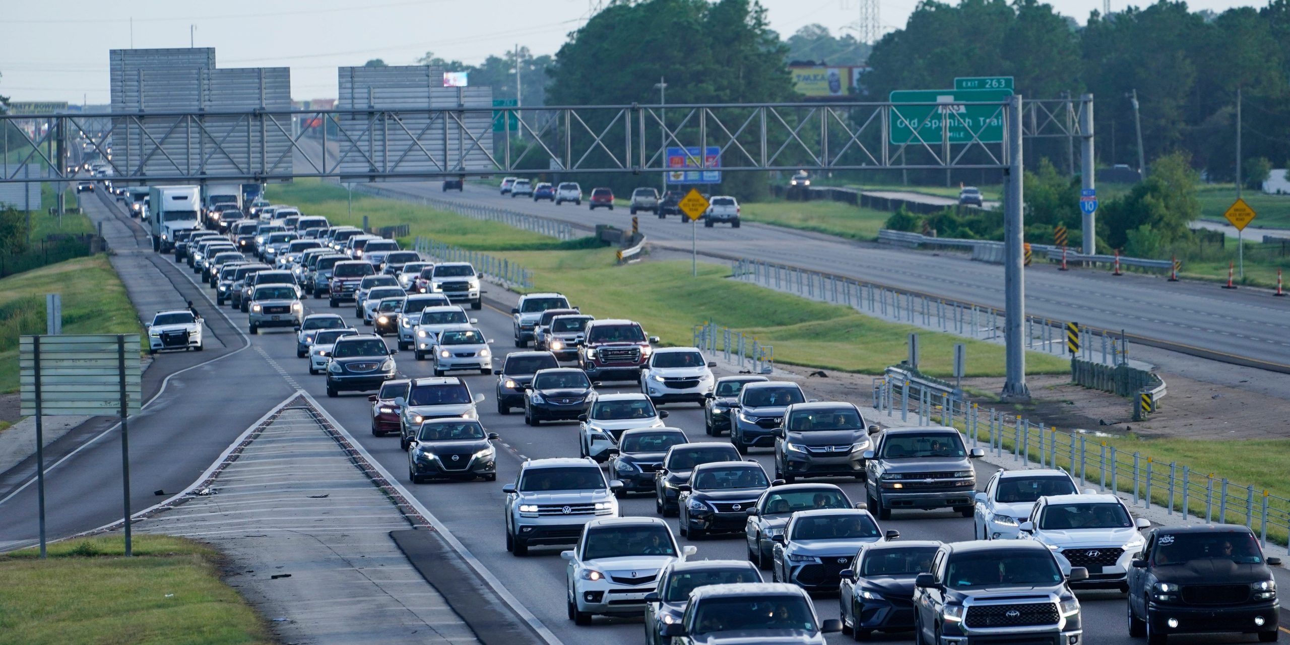 An ongoing line of cars tries to evacuate New Orleans on the highway.