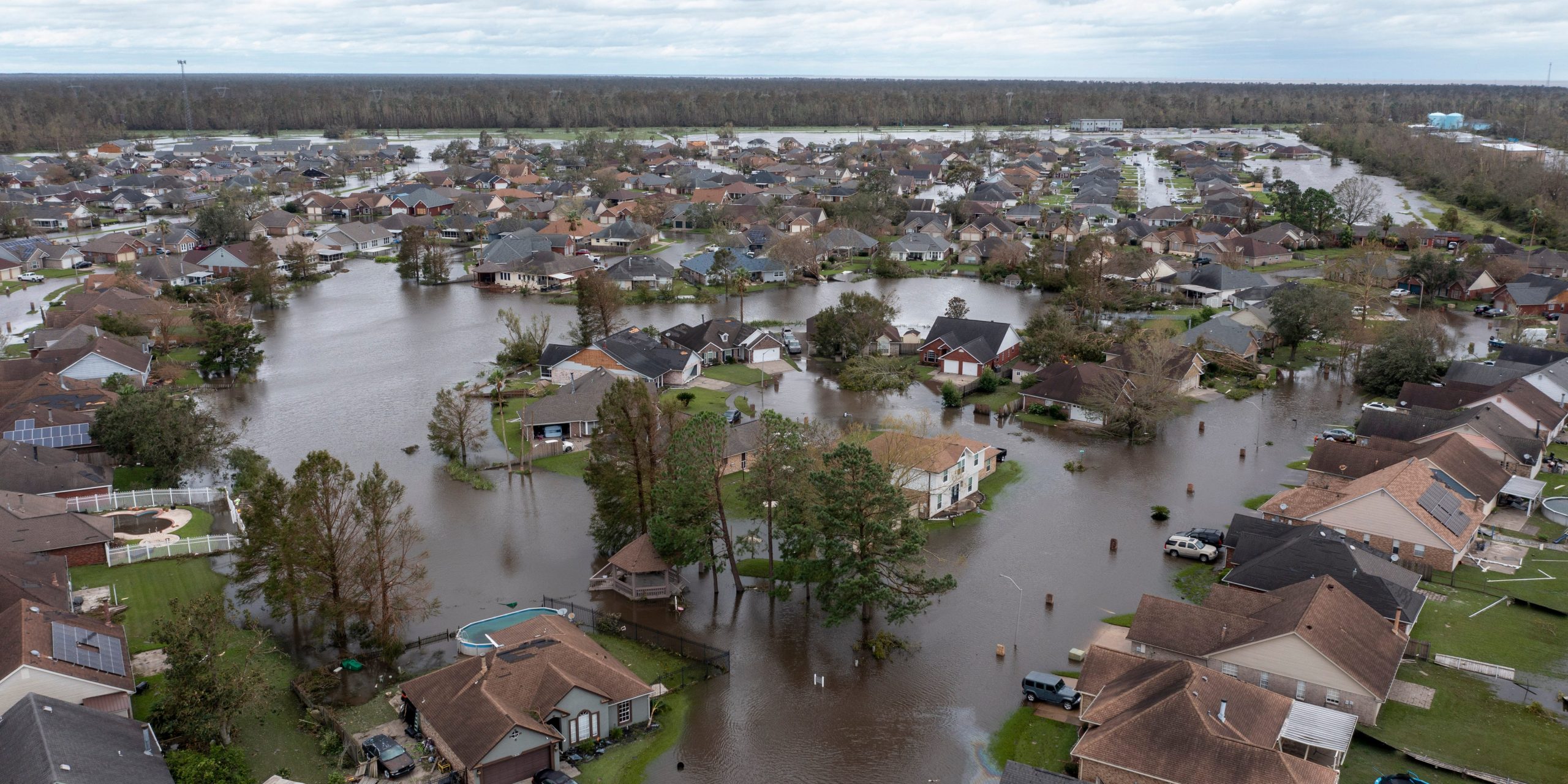 A neighborhood of houses is completely flooded.