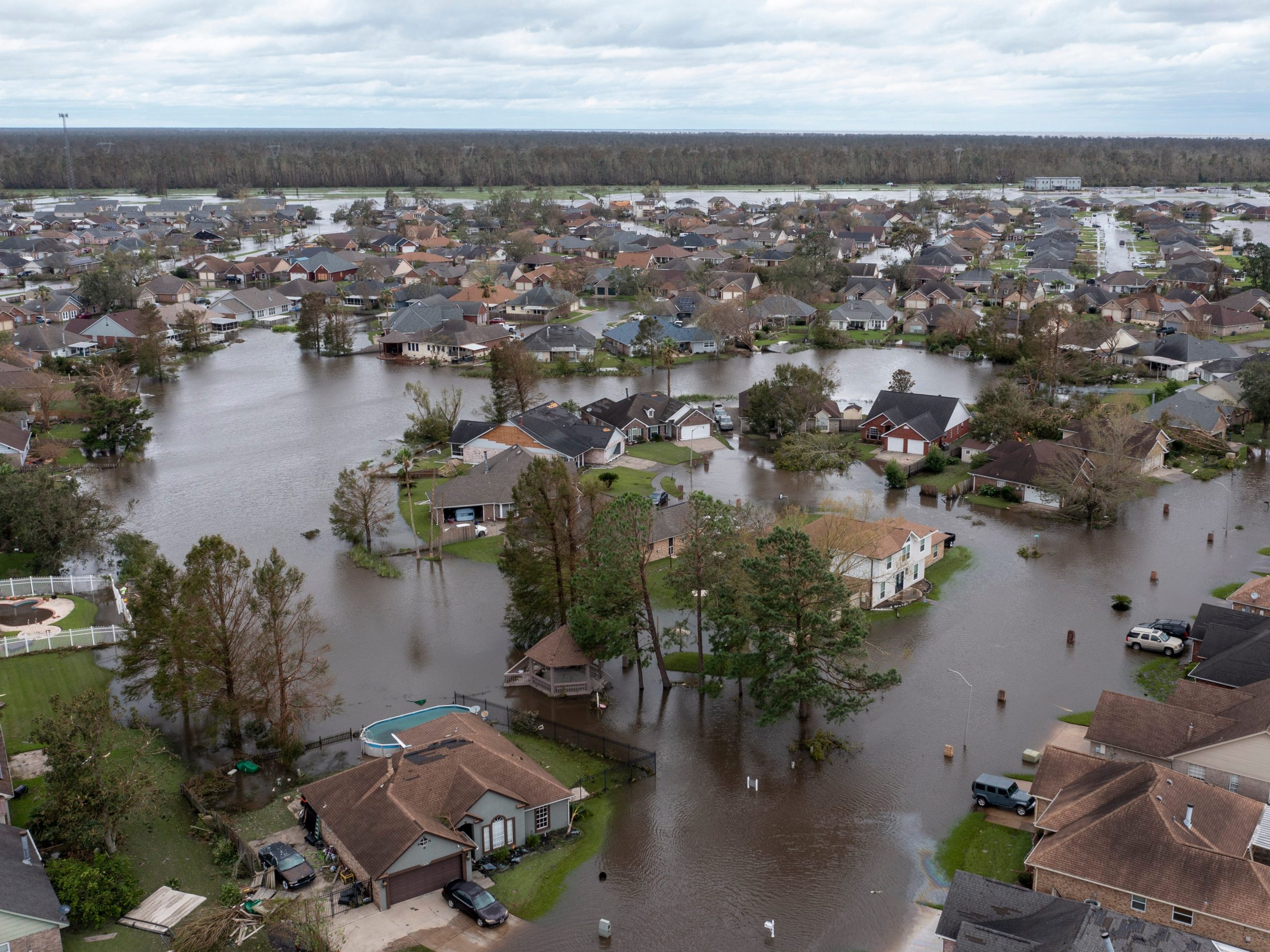 A neighborhood of houses is completely flooded.