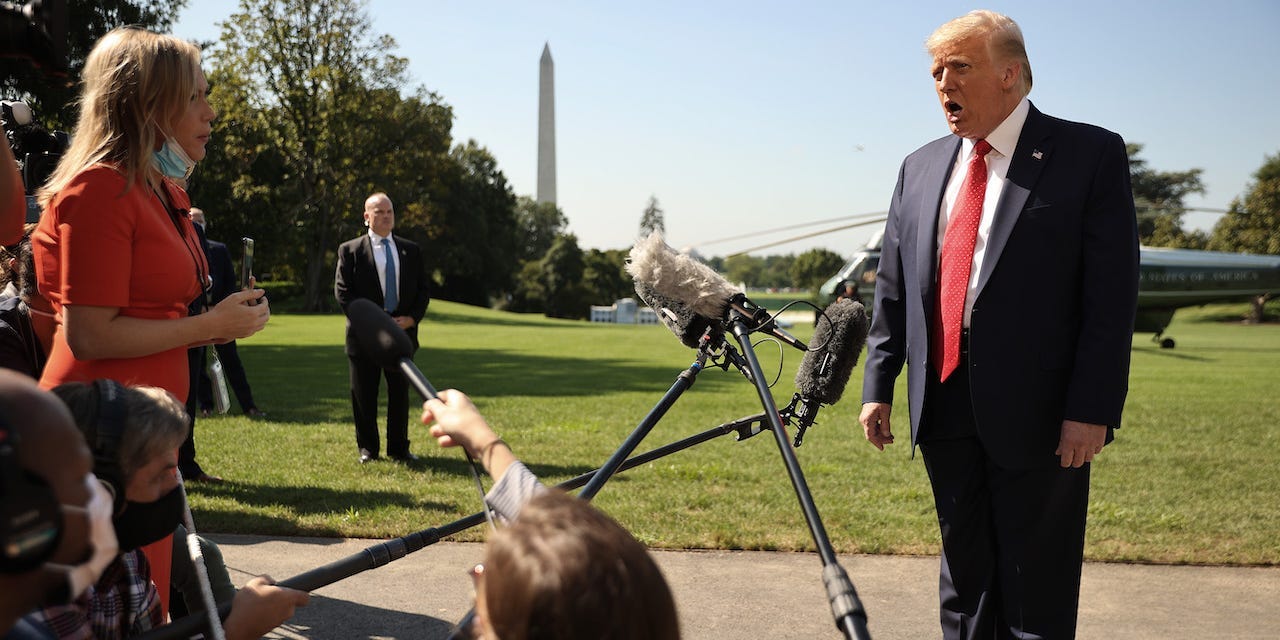 U.S. President Donald Trump talks to reporters as he leaves the White House for a trip to Minnesota and Wisconsin August 17, 2020 in Washington, DC.