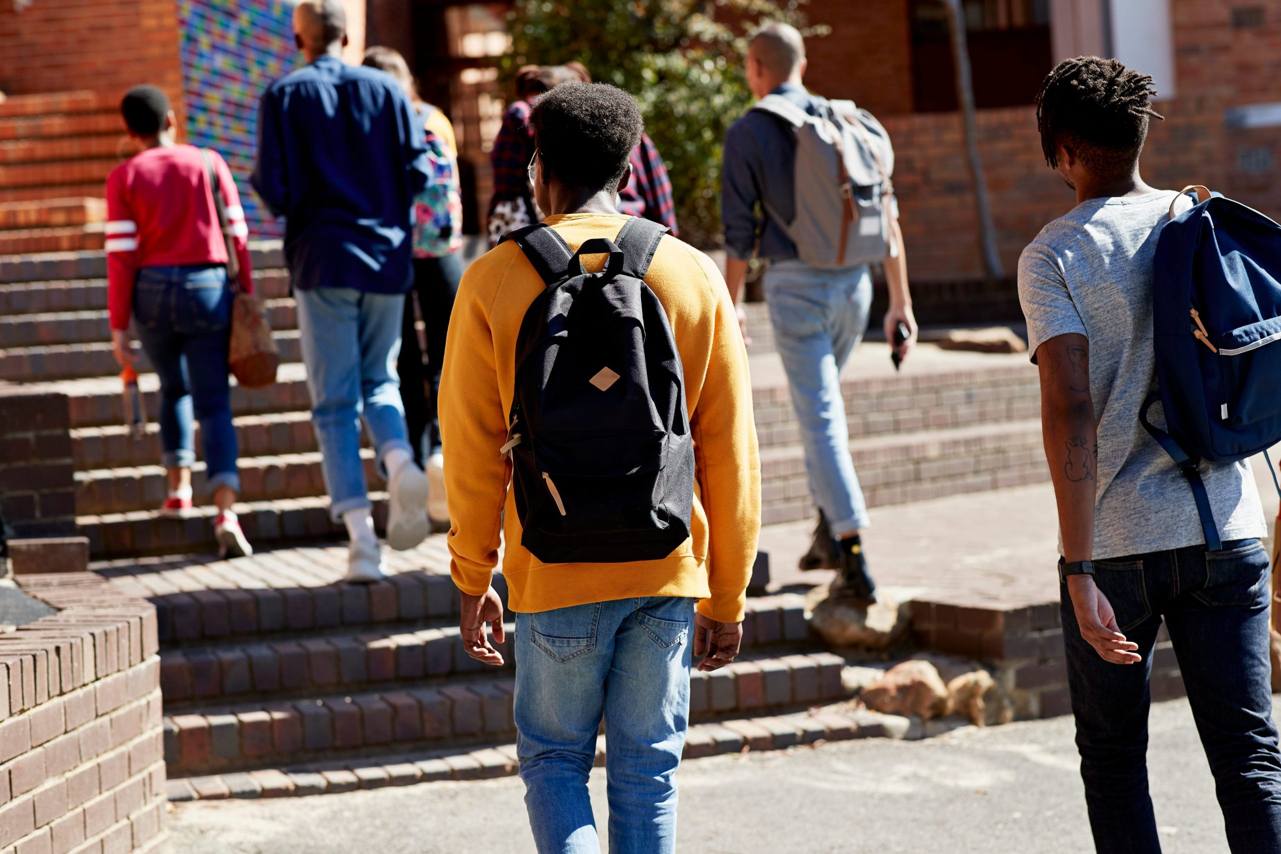 students of color walking on campus