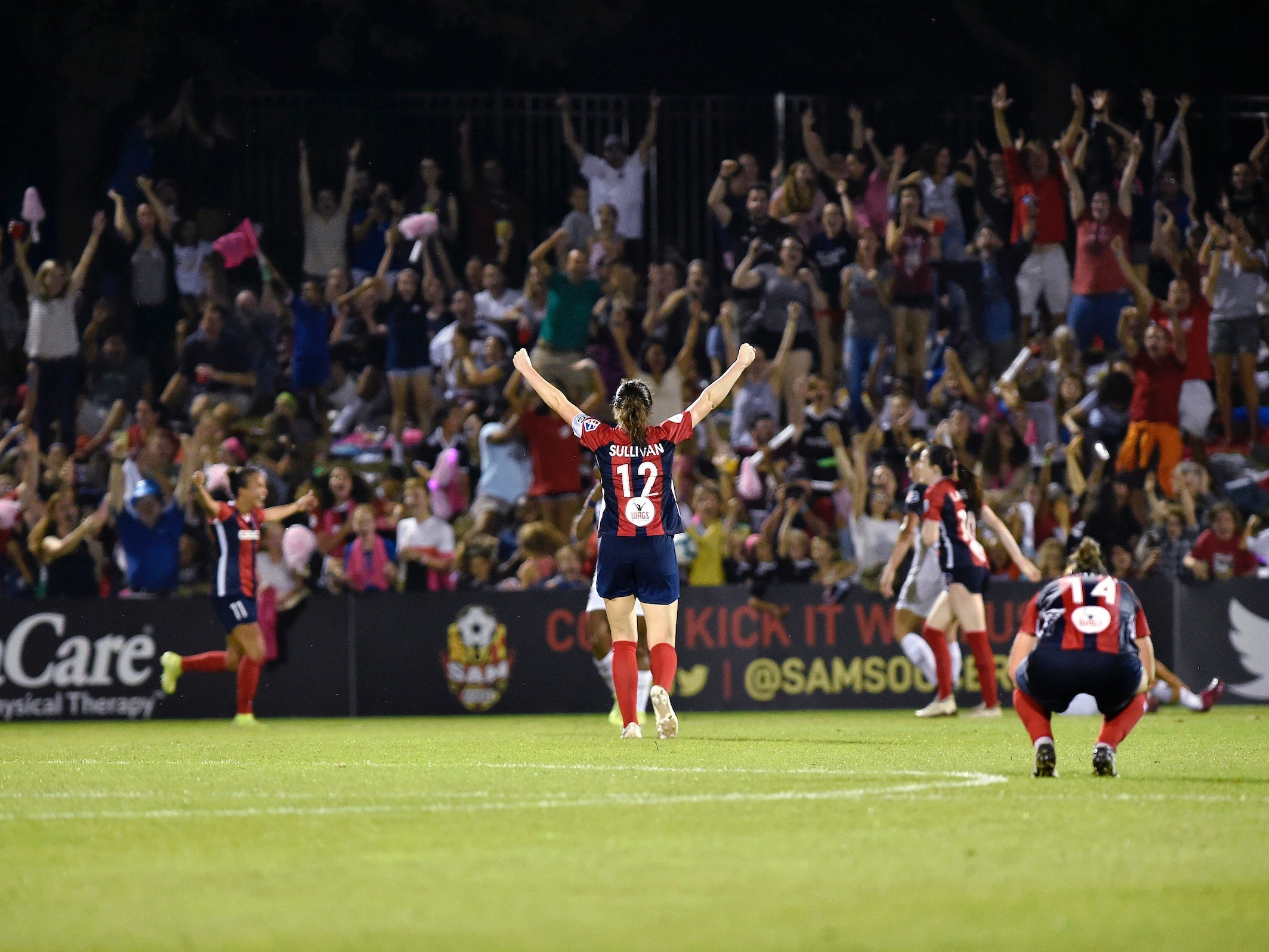 Washington Spirit midfielder Andi Sullivan (center) interacts with fans.