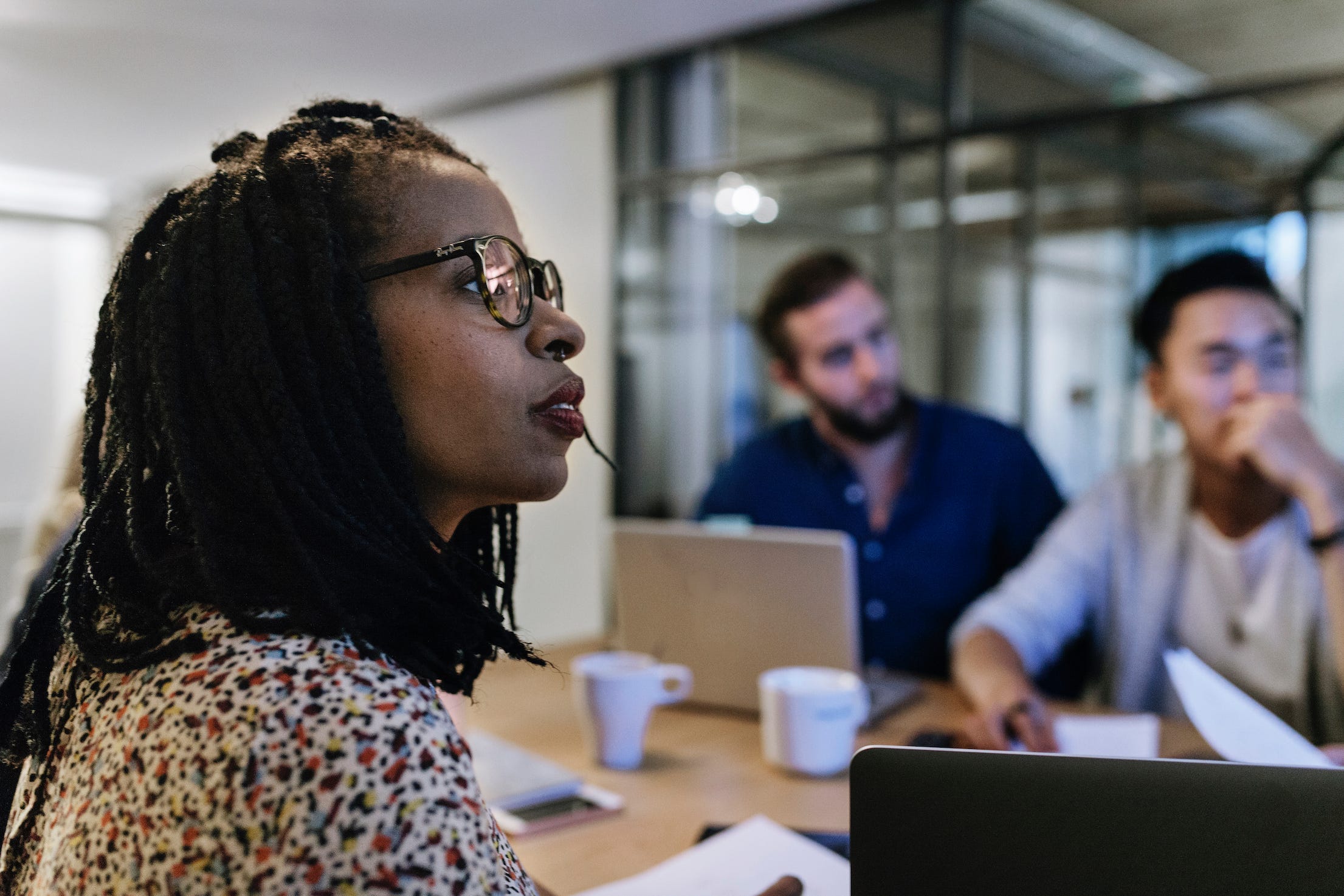 Black woman in meeting, diverse colleagues