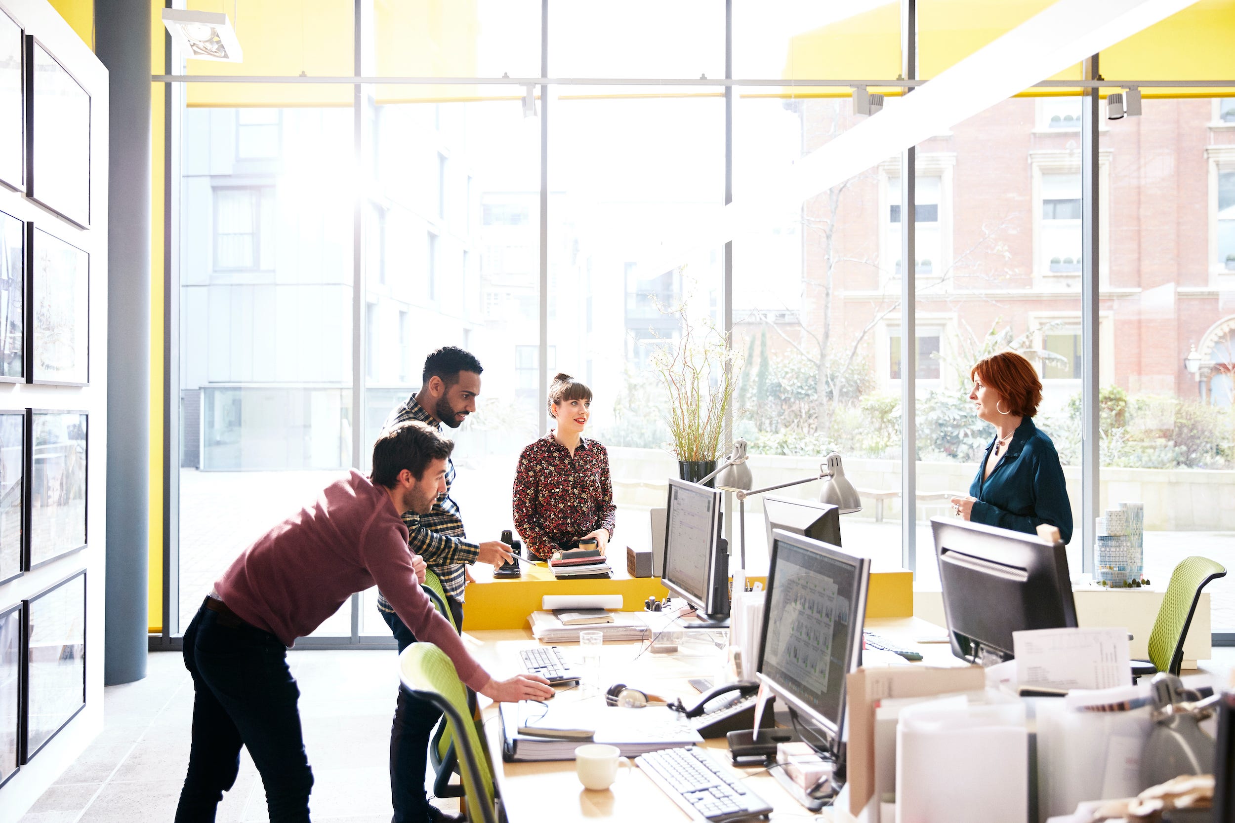 coworkers collaborating in office space