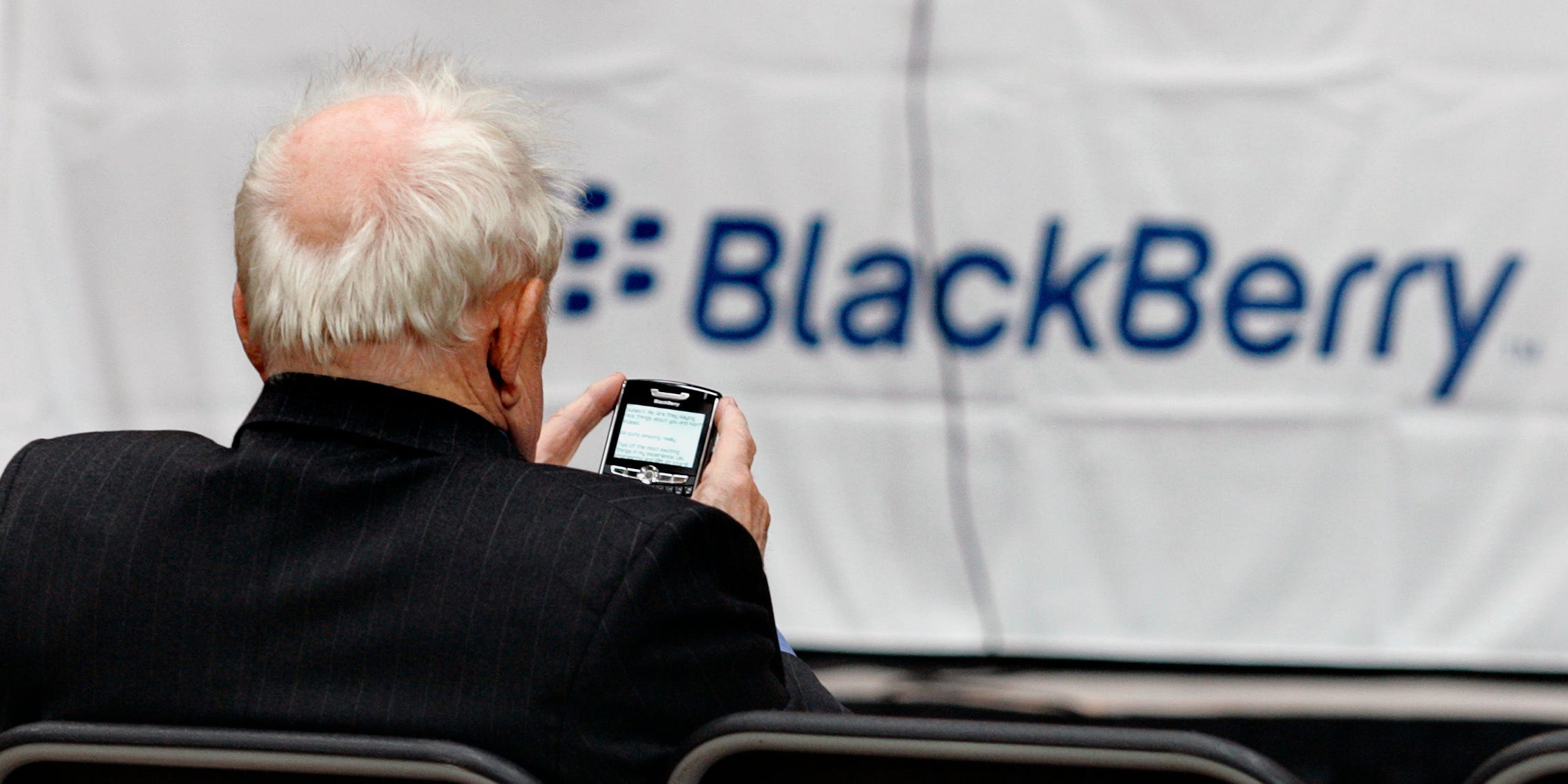 A shareholder uses his Blackberry while waiting for the Research In Motion annual meeting to begin in Waterloo, July 17, 2007.