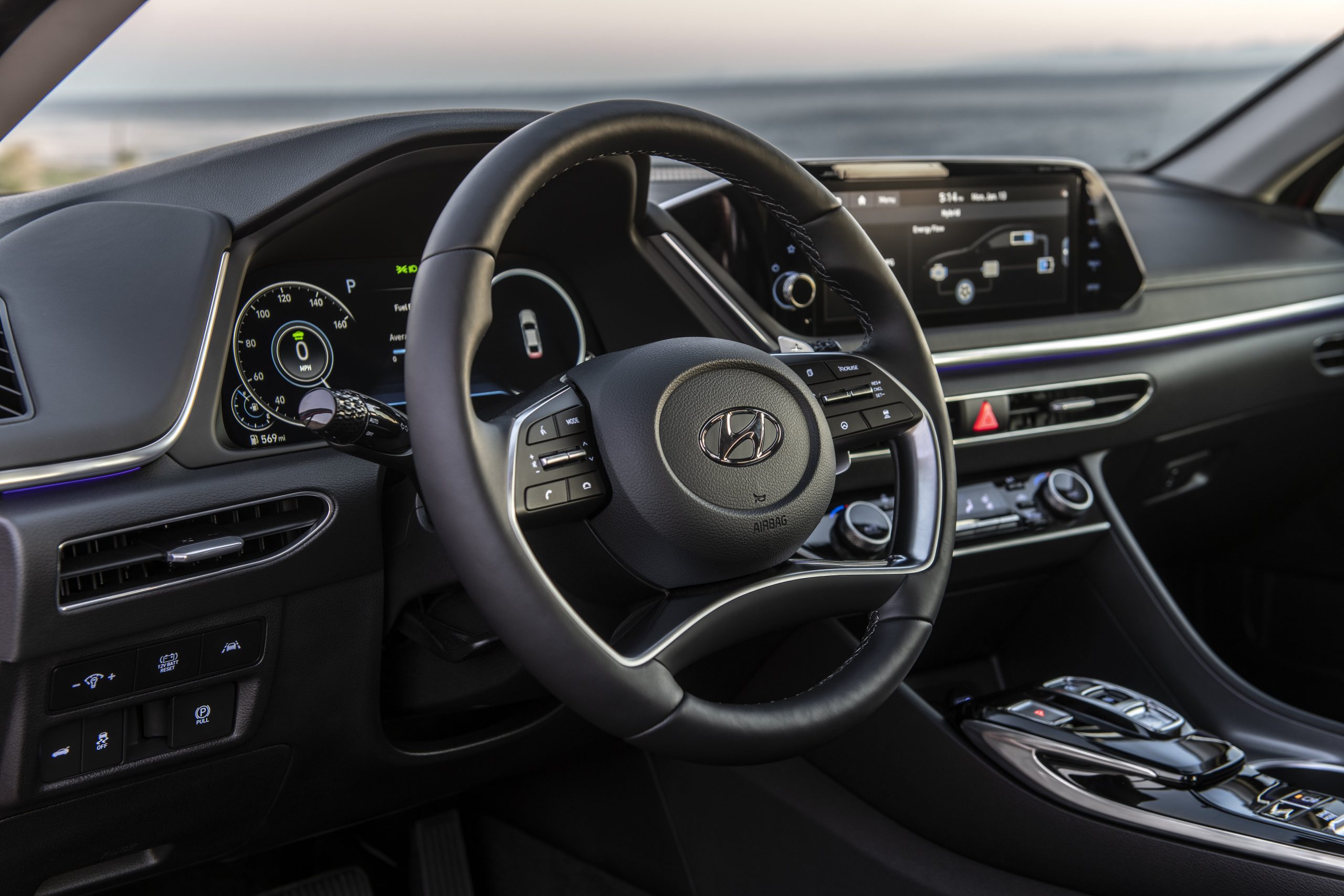 The 2021 Hyundai Sonata Hybrid's infotainment screen and steering wheel.